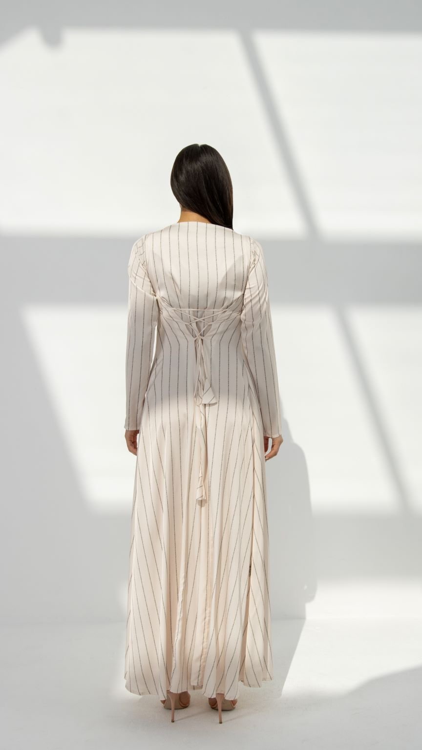 Back view of SLC Signature Dress showcasing the distinctive back X design and flowing fabric | Selected Lines