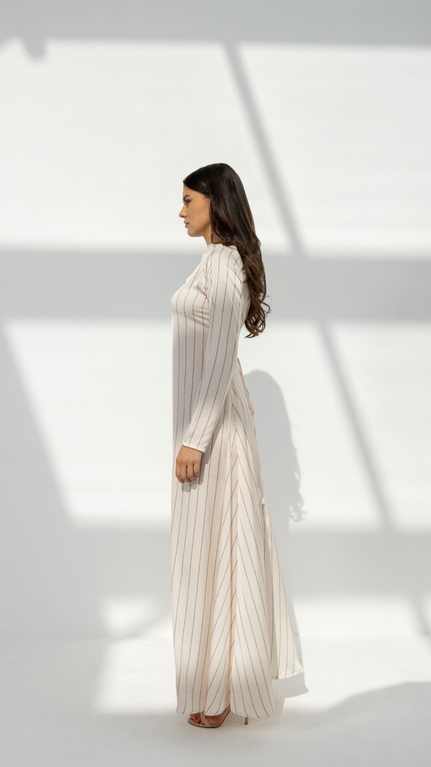 Side profile of SLC Signature Dress highlighting the fit size and elegant silhouette | Selected Lines