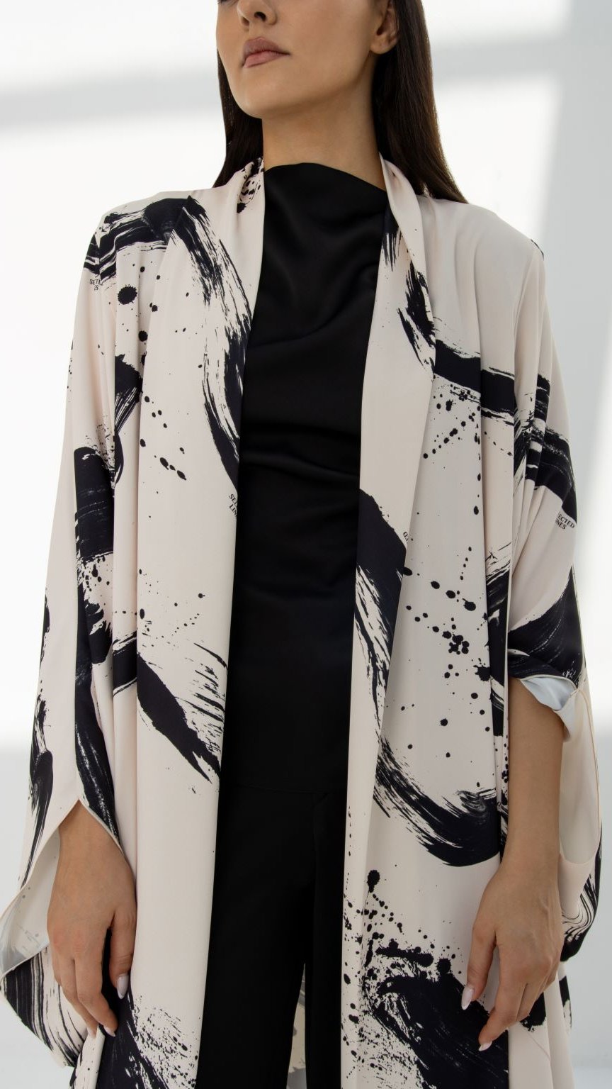 Close-up of SLC Wide Abaya’s exclusive paint-printed fabric and intricate design elements | Selected Lines