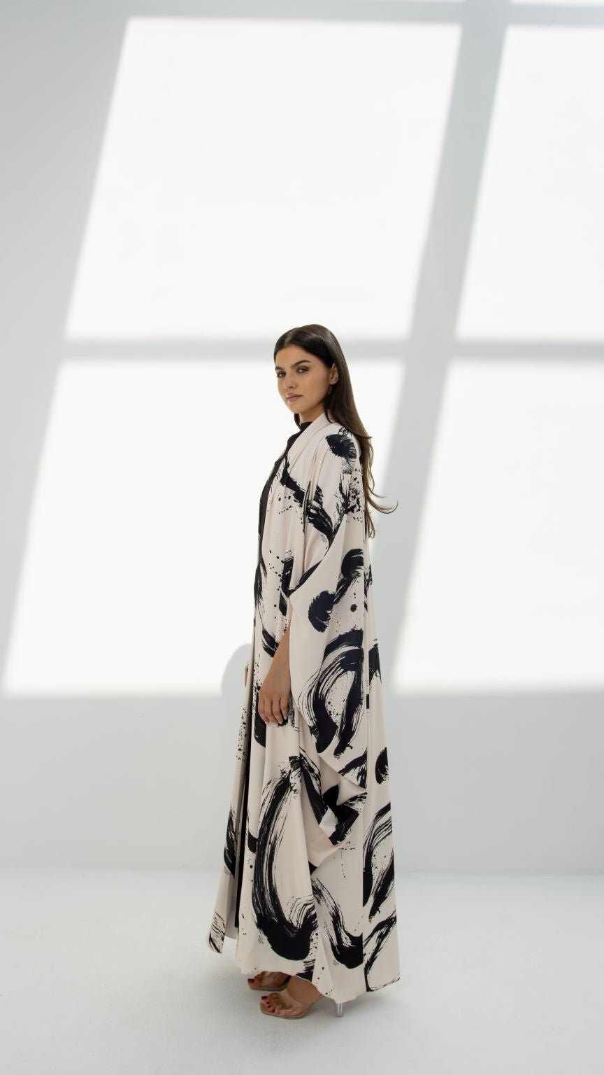 Side profile of SLC Wide Abaya highlighting the unique paint-printed fabric and design details | Selected Lines