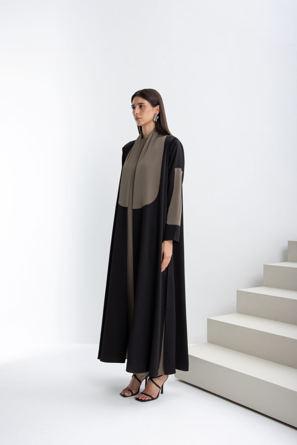 Timeless handcrafted abaya in black and taupe with elegant design suitable for special occasions
