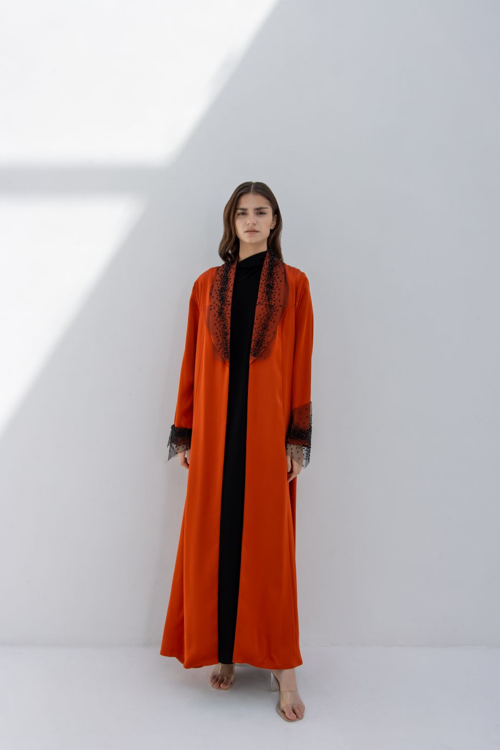 Selected Lines elegant tulle evening abaya in orange with black lace details on collar and sleeves