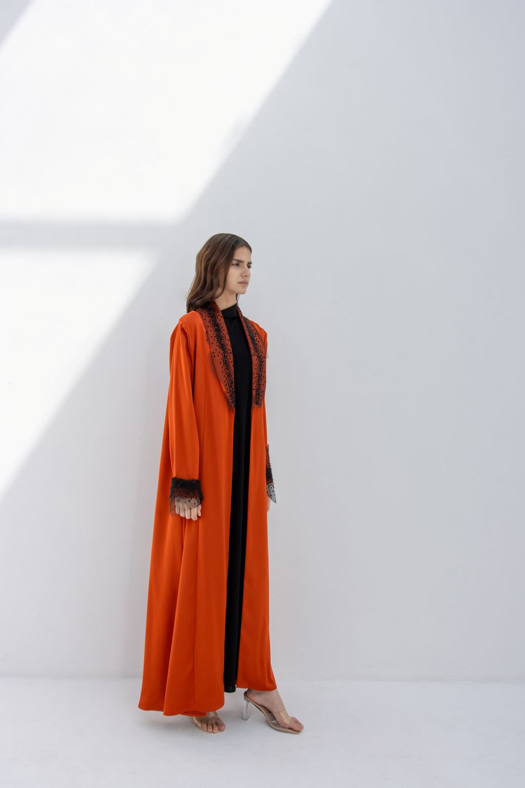 Selected Lines elegant tulle evening abaya in orange with black lace detailing on collar and cuffs