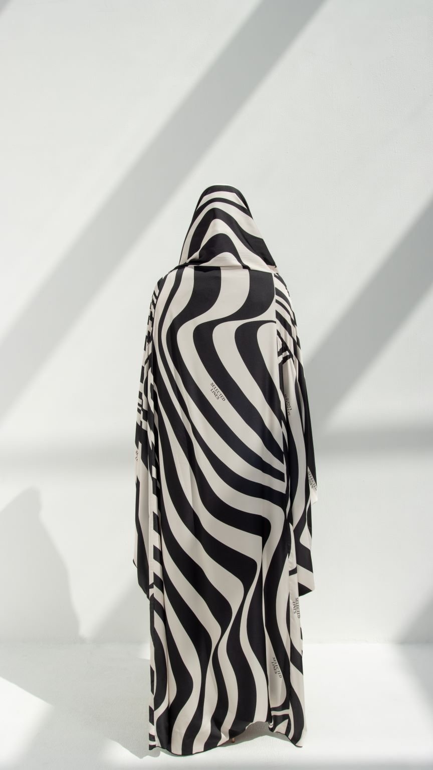 Back view of Zebra-Hoodie Abaya showcasing the Bahraini cut and zebra print design | Selected Lines