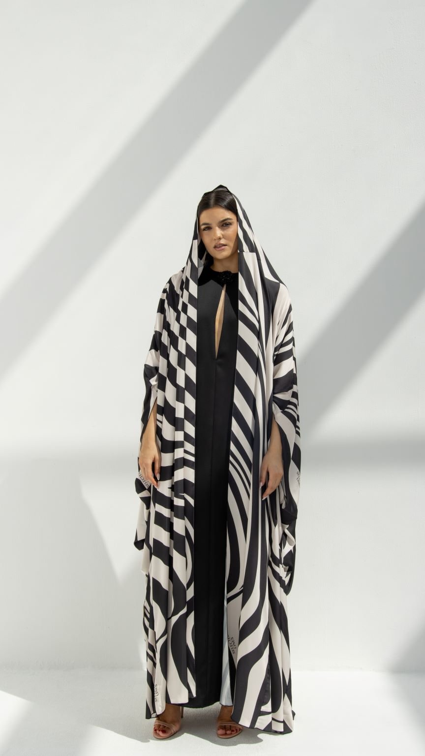 Front view of Zebra-Hoodie Abaya featuring SLC printed zebra fabric with Bahraini cut and hoodie | Selected Lines