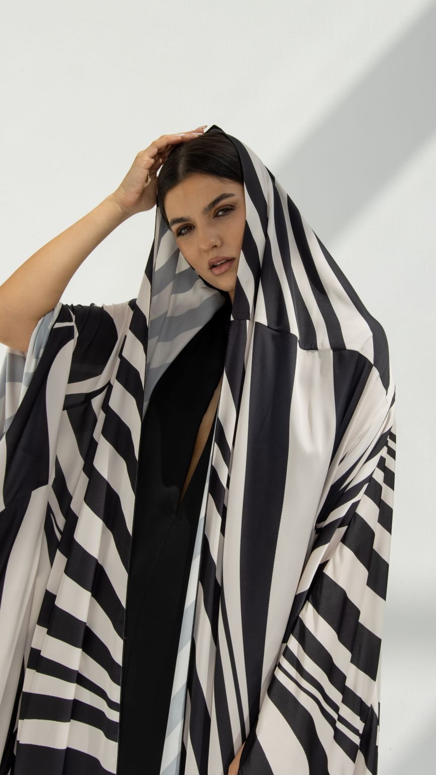 Zebra-Hoodie Abaya paired with matching dress, featuring SLC printed zebra fabric and Bahraini hoodie design | Selected Lines