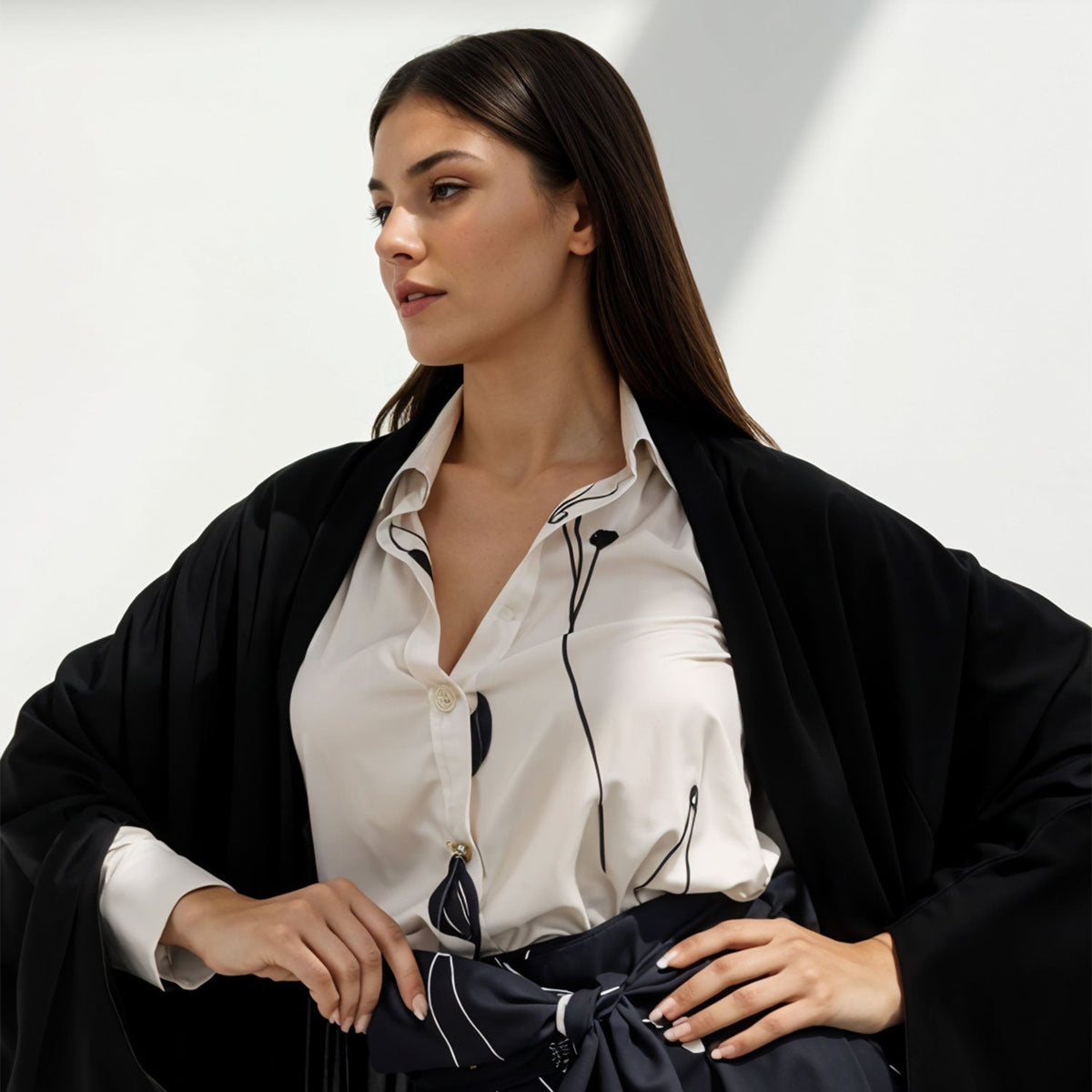 Model wearing elegant black and white outfit for luxury fashion show 2024 collection