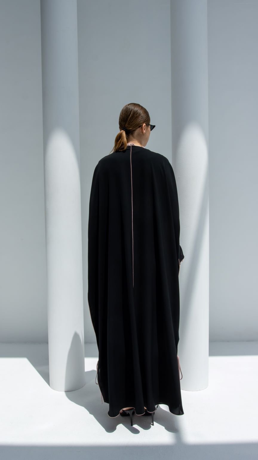 Elegant black Bahraini ribbon abaya with a sleek design and back detail for modern style