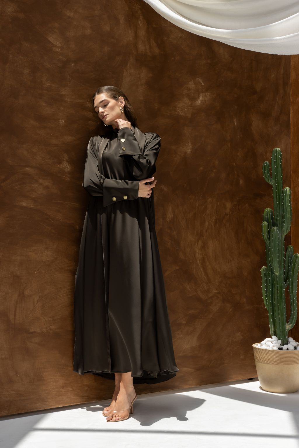 Selected Lines black elegant evening dress abaya with gold button details and long sleeves
