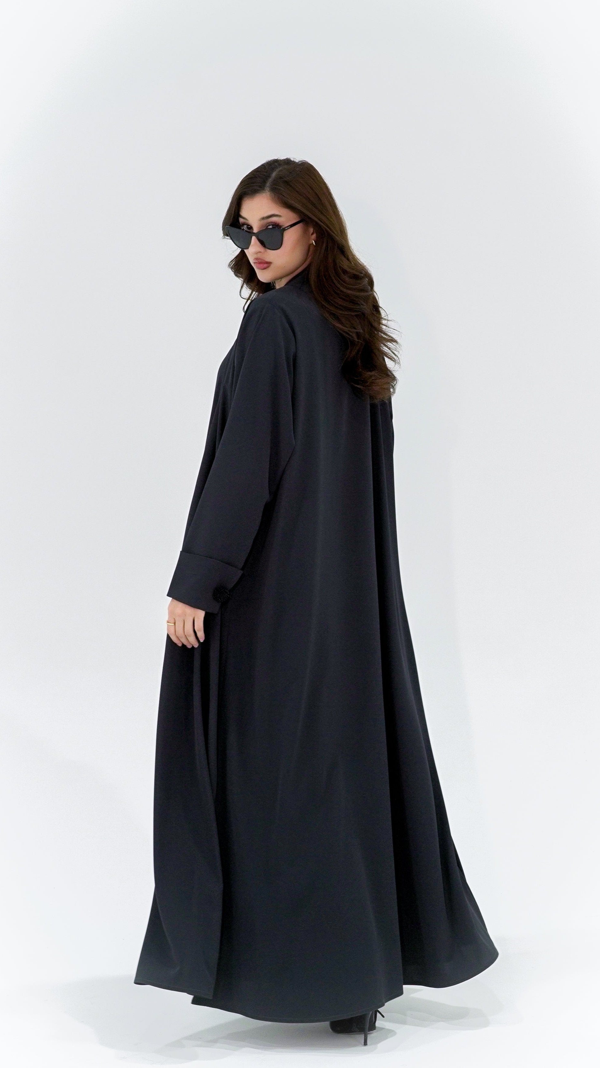 Selected Lines charcoal pearl sleeve abaya worn by woman with sunglasses in black full-length modest dress