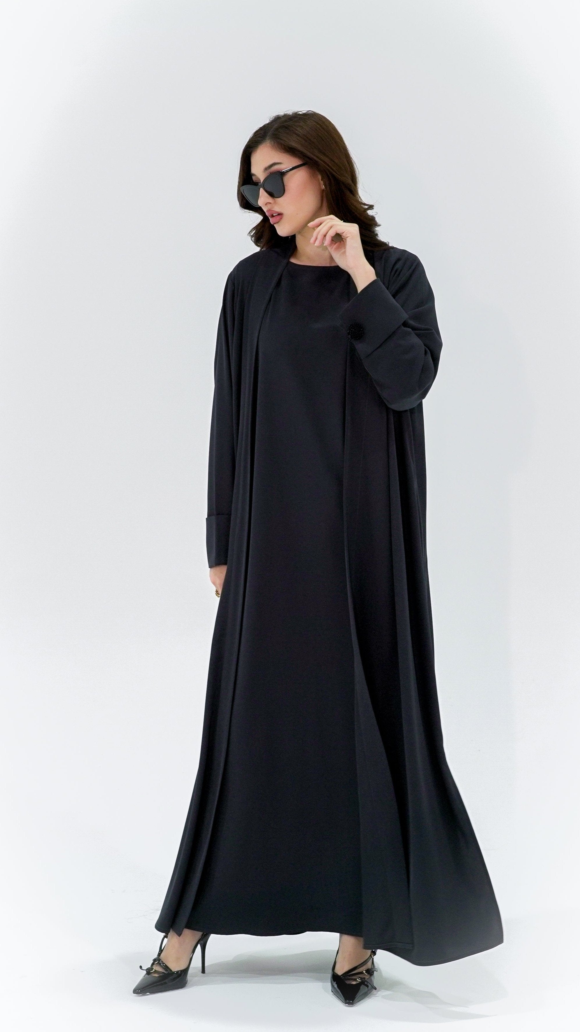 Selected Lines charcoal pearl sleeve abaya worn by model with black heels and sunglasses