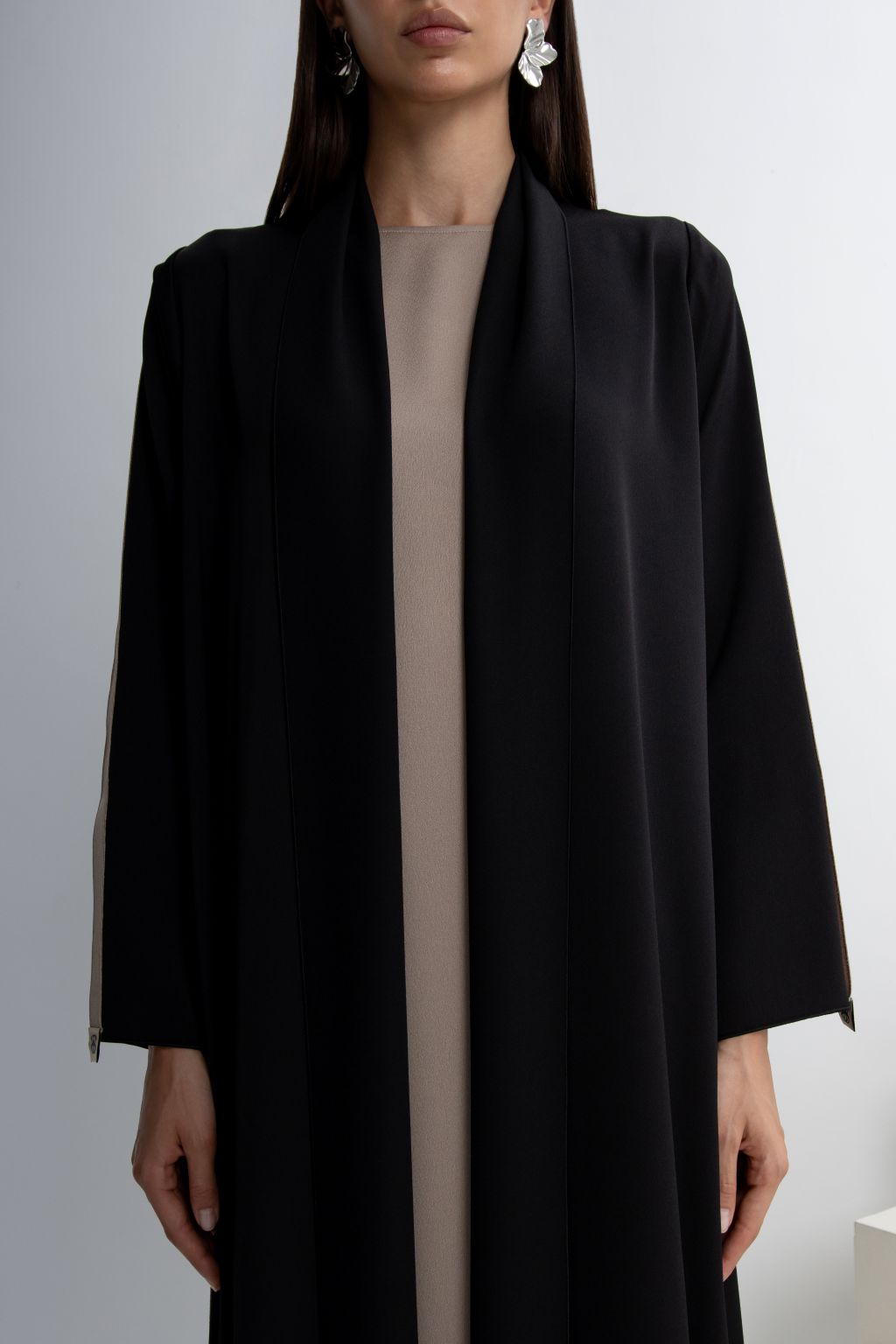 Elegant black designer abaya dress for occasions featuring a sleek design and sophisticated style