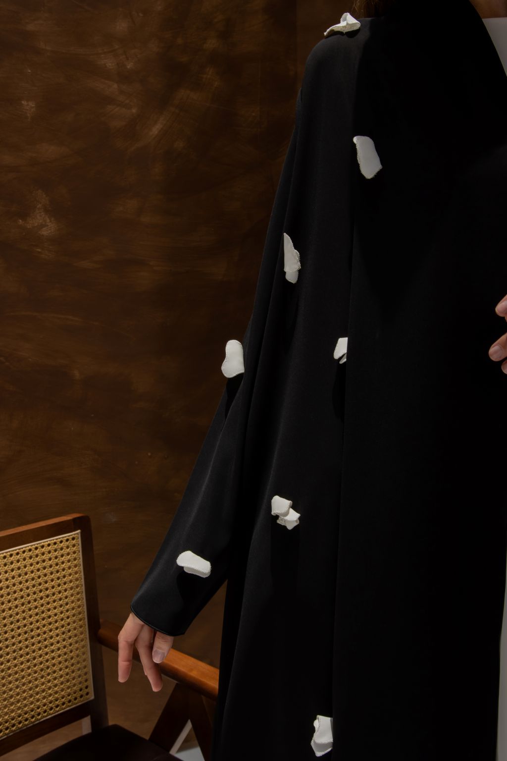 Selected Lines black abaya with designer abaya handcrafted details and white embellishments on sleeve