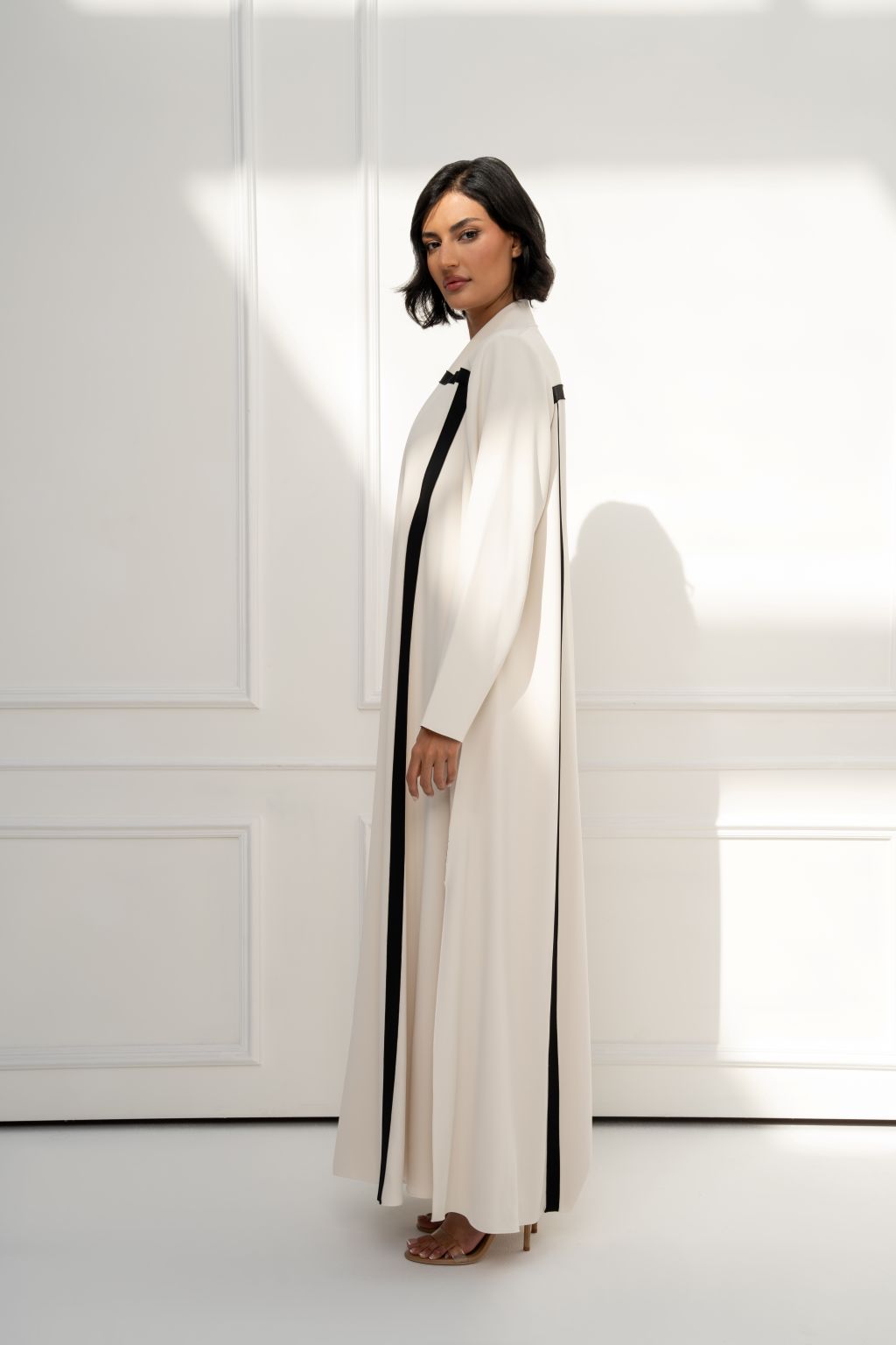 Selected Lines Cream Abaya with Black Stripes, a chic choice in designer evening wear for women.