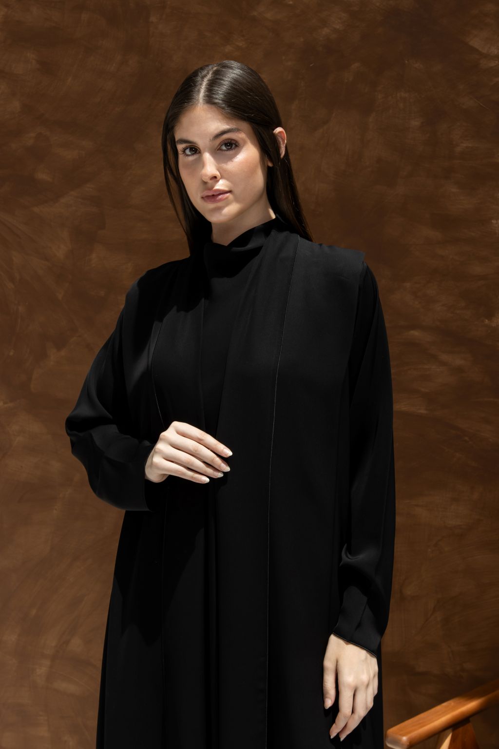 Elegant black abaya designed for stylish comfort with a sleek silhouette and modern details