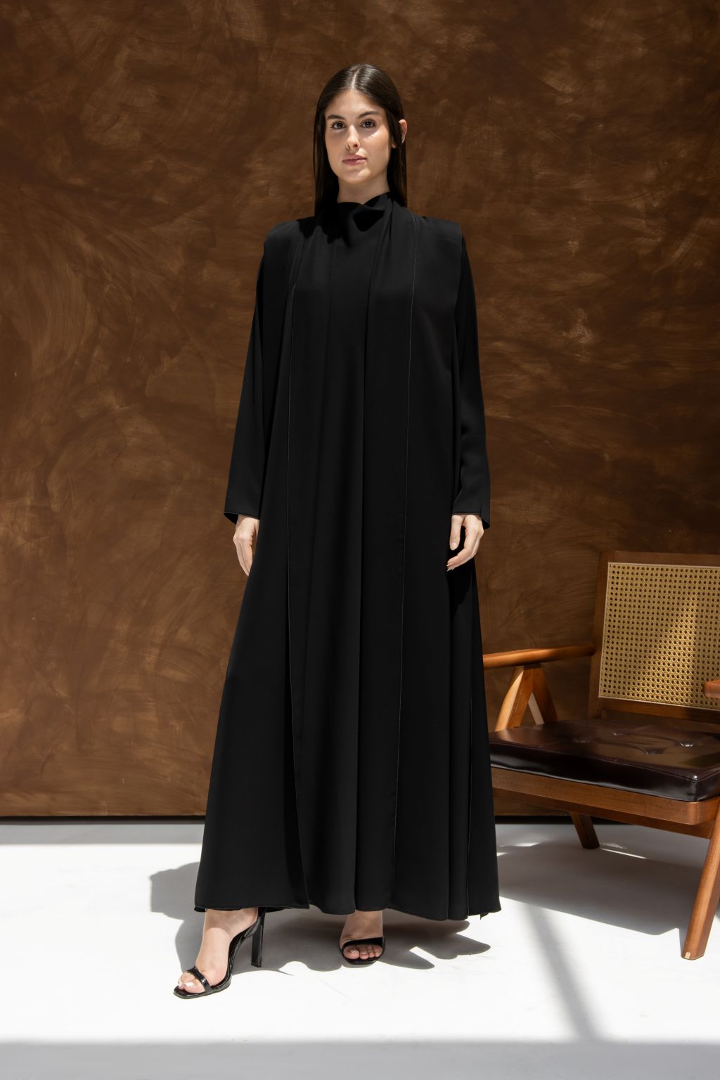 Elegant black abaya with a flowing design and long sleeves for sophisticated style