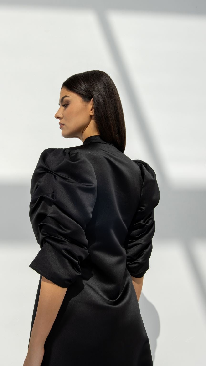 Selected Lines elegant button line dress in black with puffed sleeves and ruched detailing