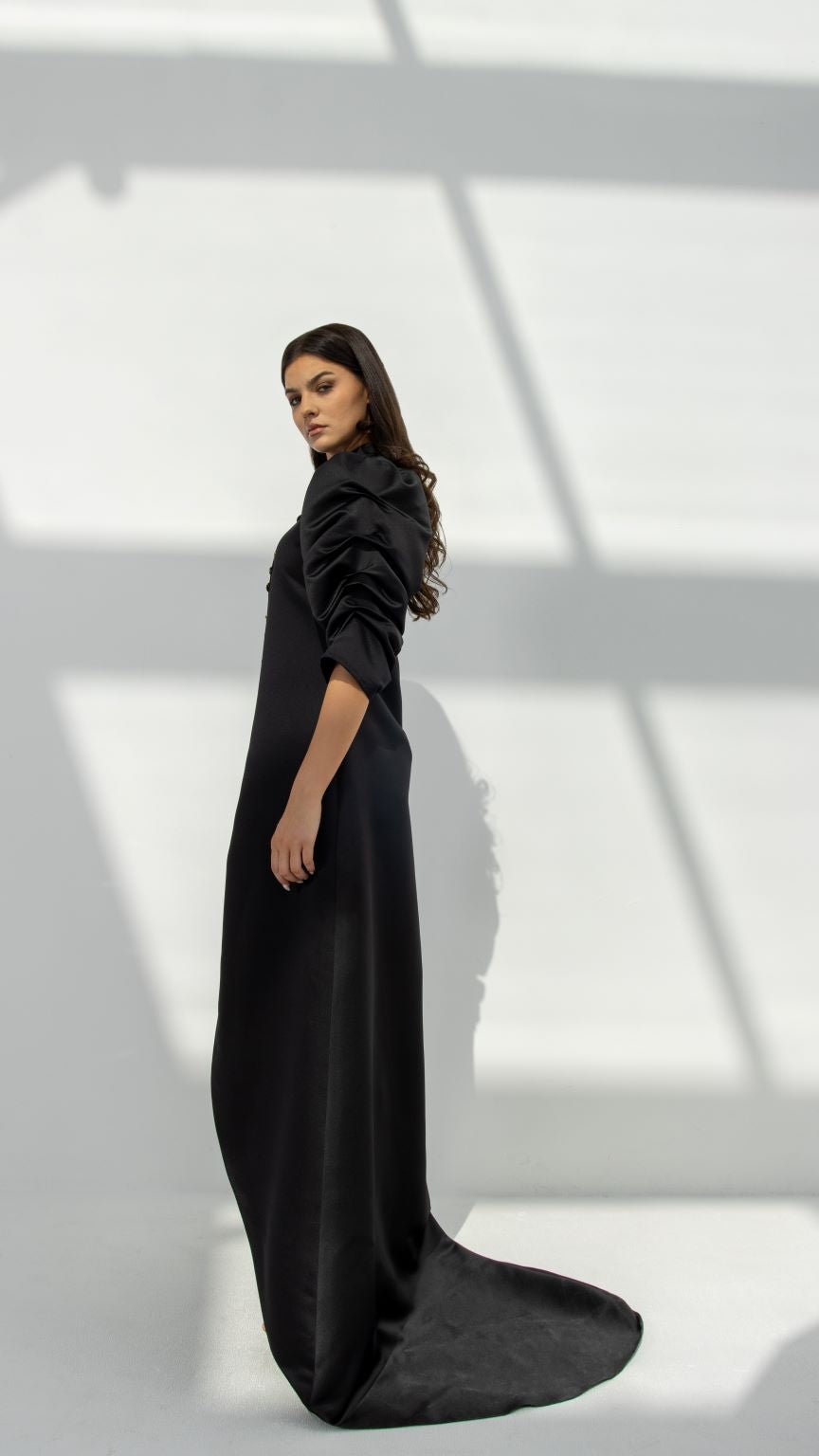 Selected Lines elegant button line dress in black with ruched sleeves and long flowing train