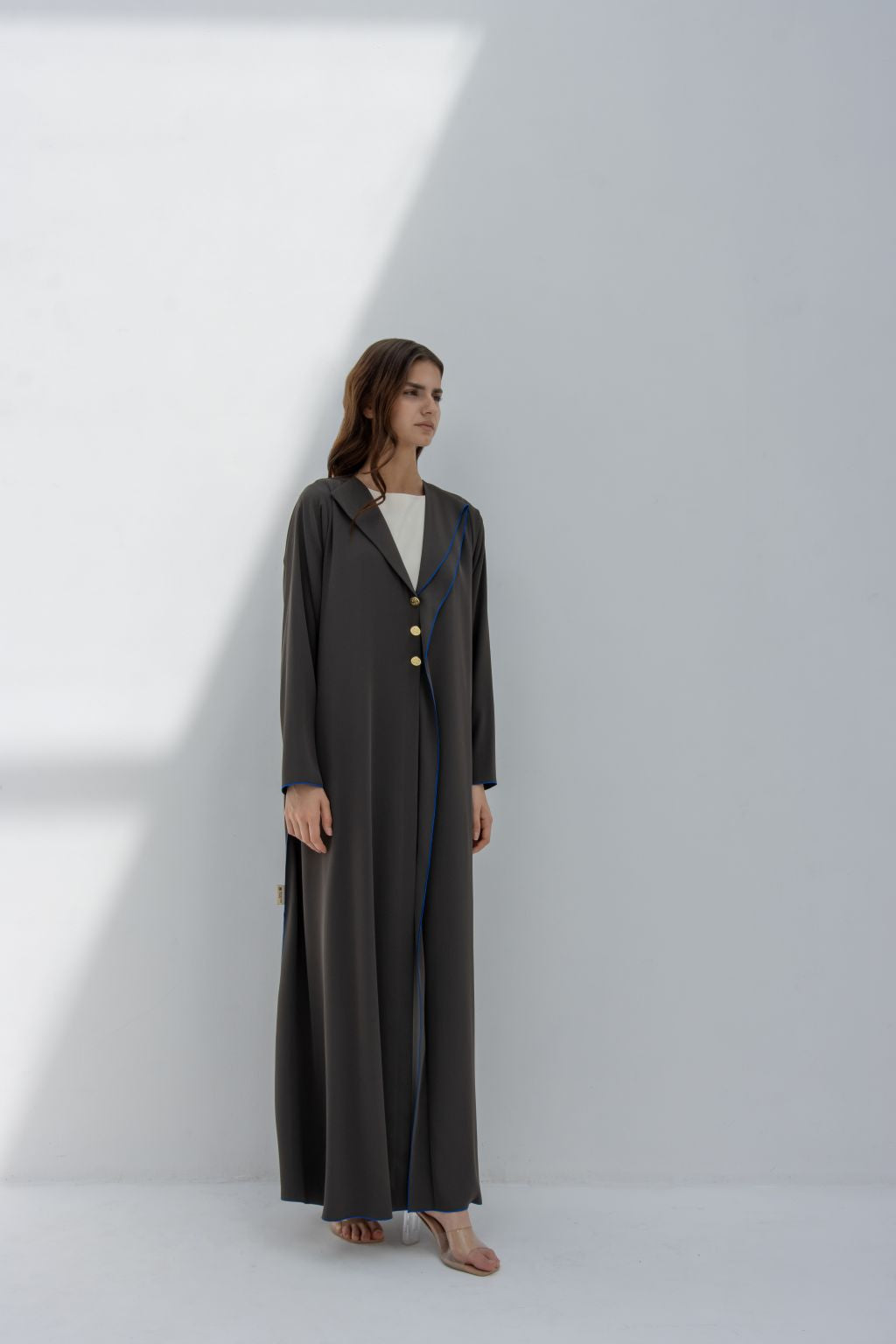 Selected Lines elegant Curve Buttons abaya in dark color with long sleeves worn by model