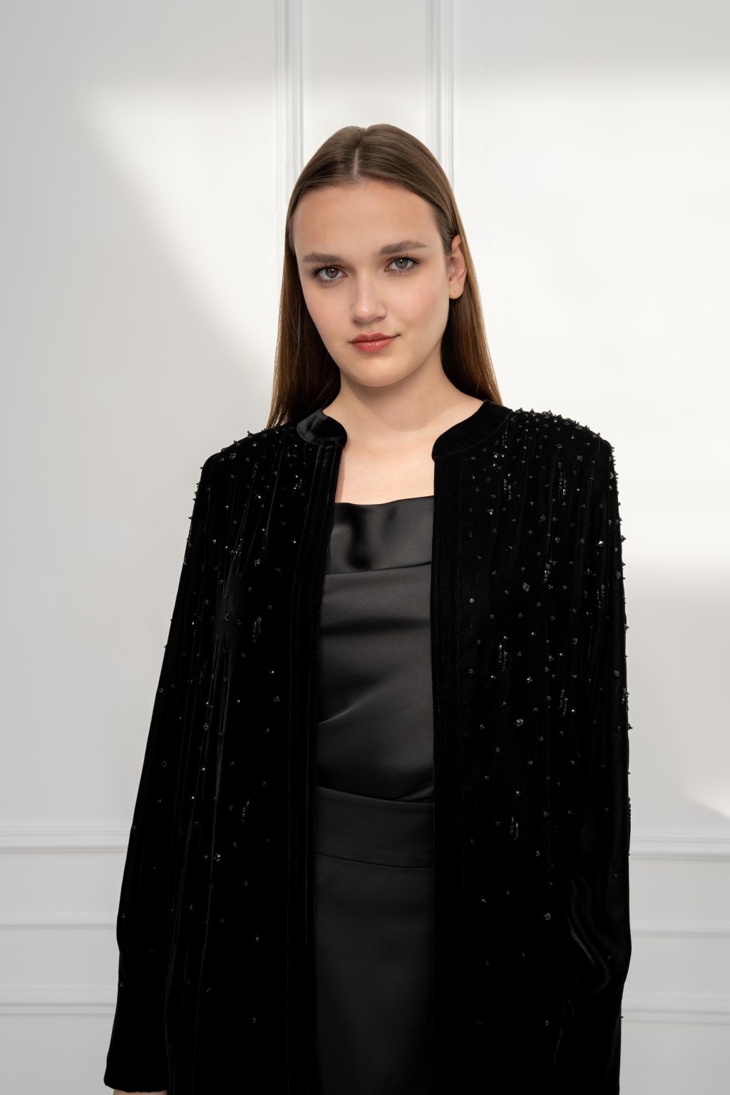Selected Lines elegant formal outerwear abaya in black with elegant beaded design and a sleek silhouette.