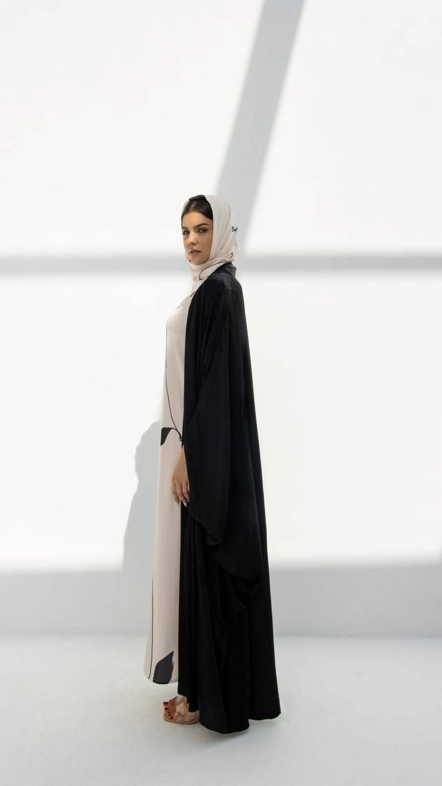 Elegant FS Jameela Abaya by Selected Lines worn by a woman posing against a bright white background