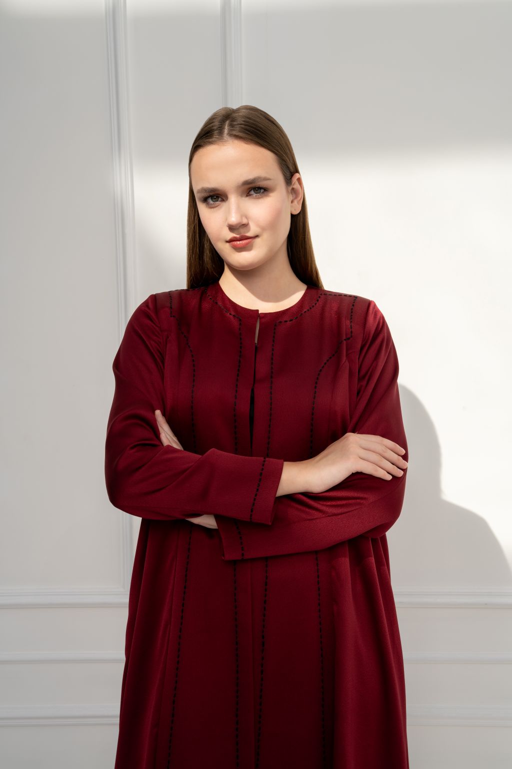 Selected Lines burgundy abaya with intricate detailing, perfect as an elegant modest evening dress.