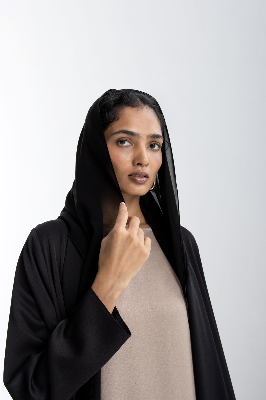 Elegant modest fashion dress in black with a modern design and stylish hood, perfect for various occasions.