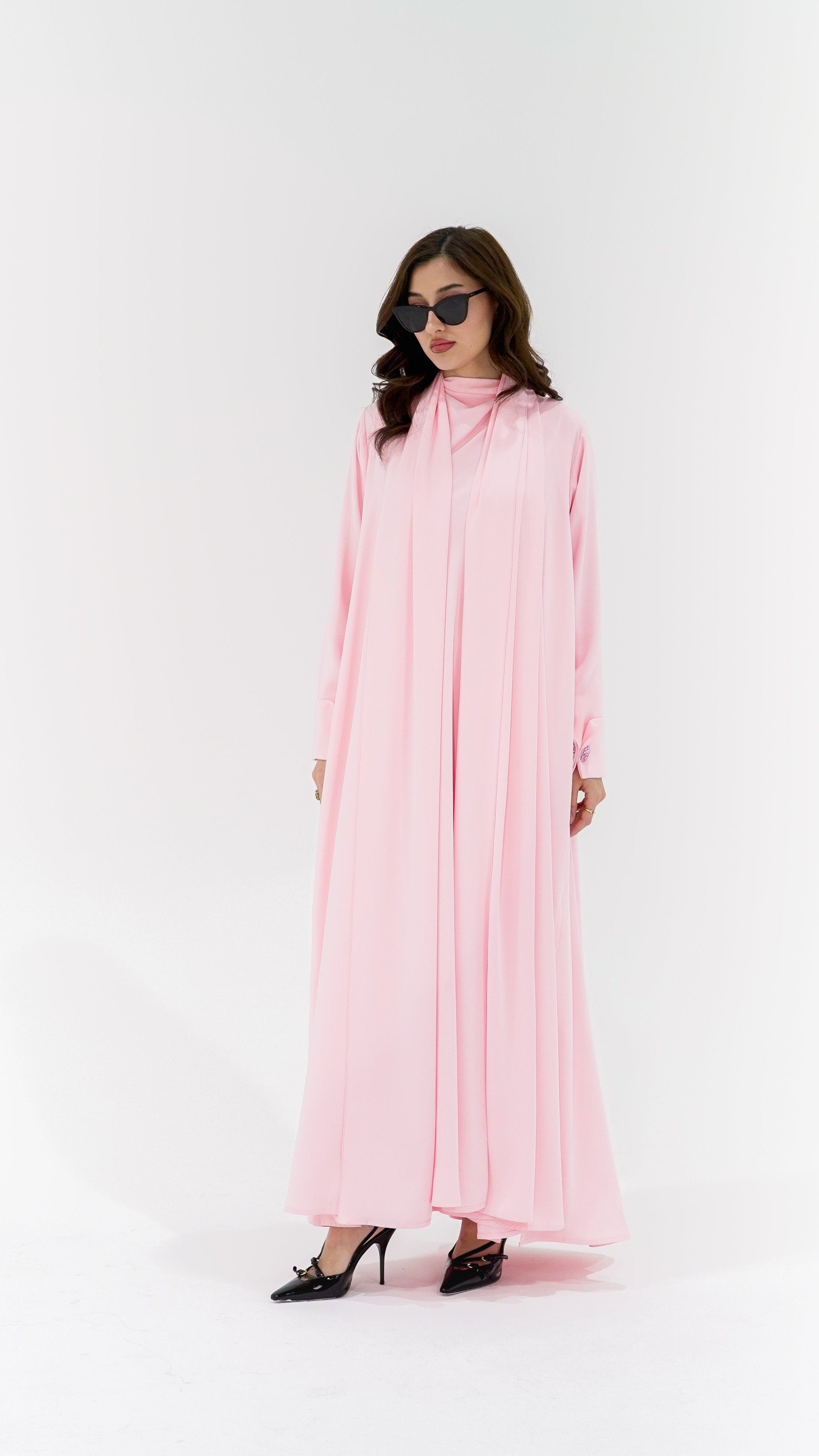 Elegant pearl buttons abaya in soft pink with flowing design and long sleeves