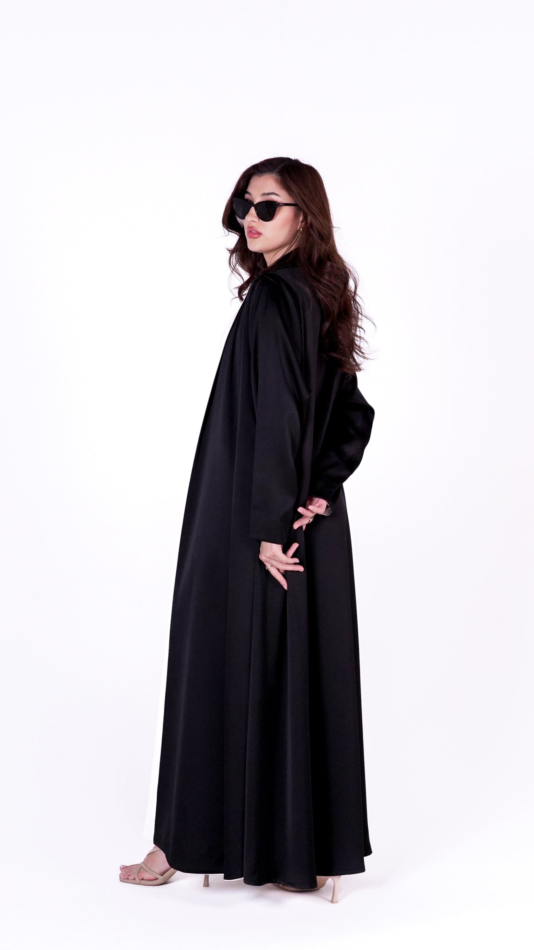 Elegant twist abaya in black with a flowing silhouette, perfect for stylish outings and events