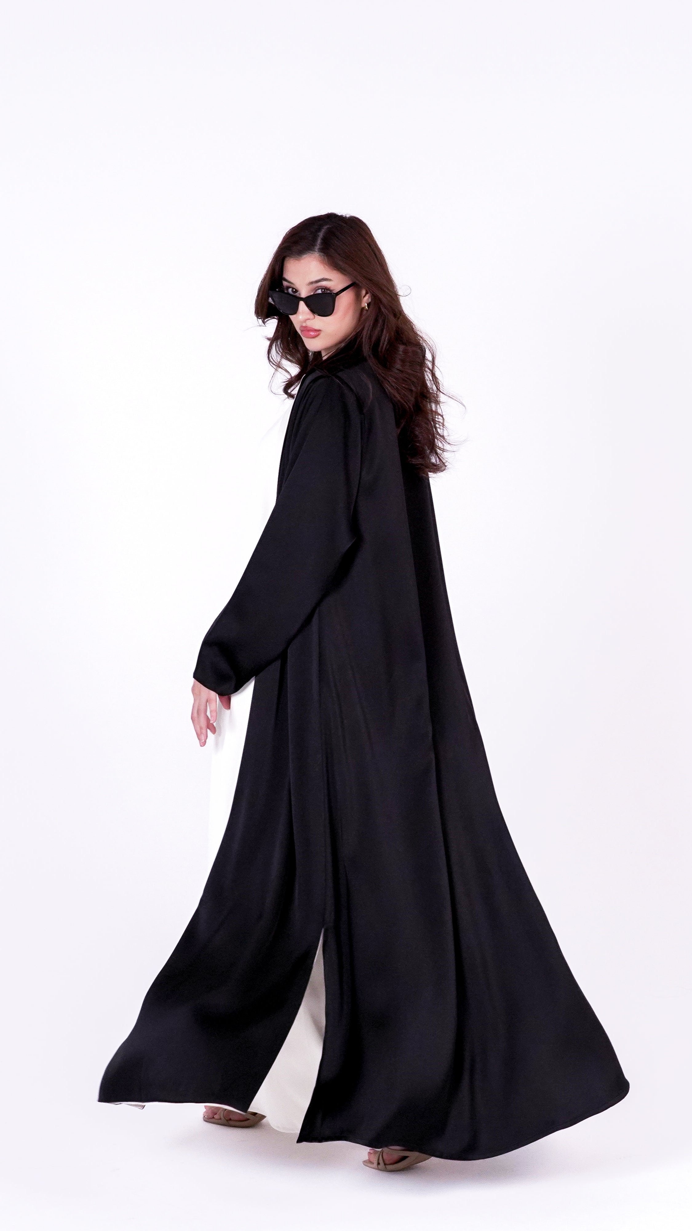 Elegant twist abaya in black with flowing design, perfect for stylish occasions