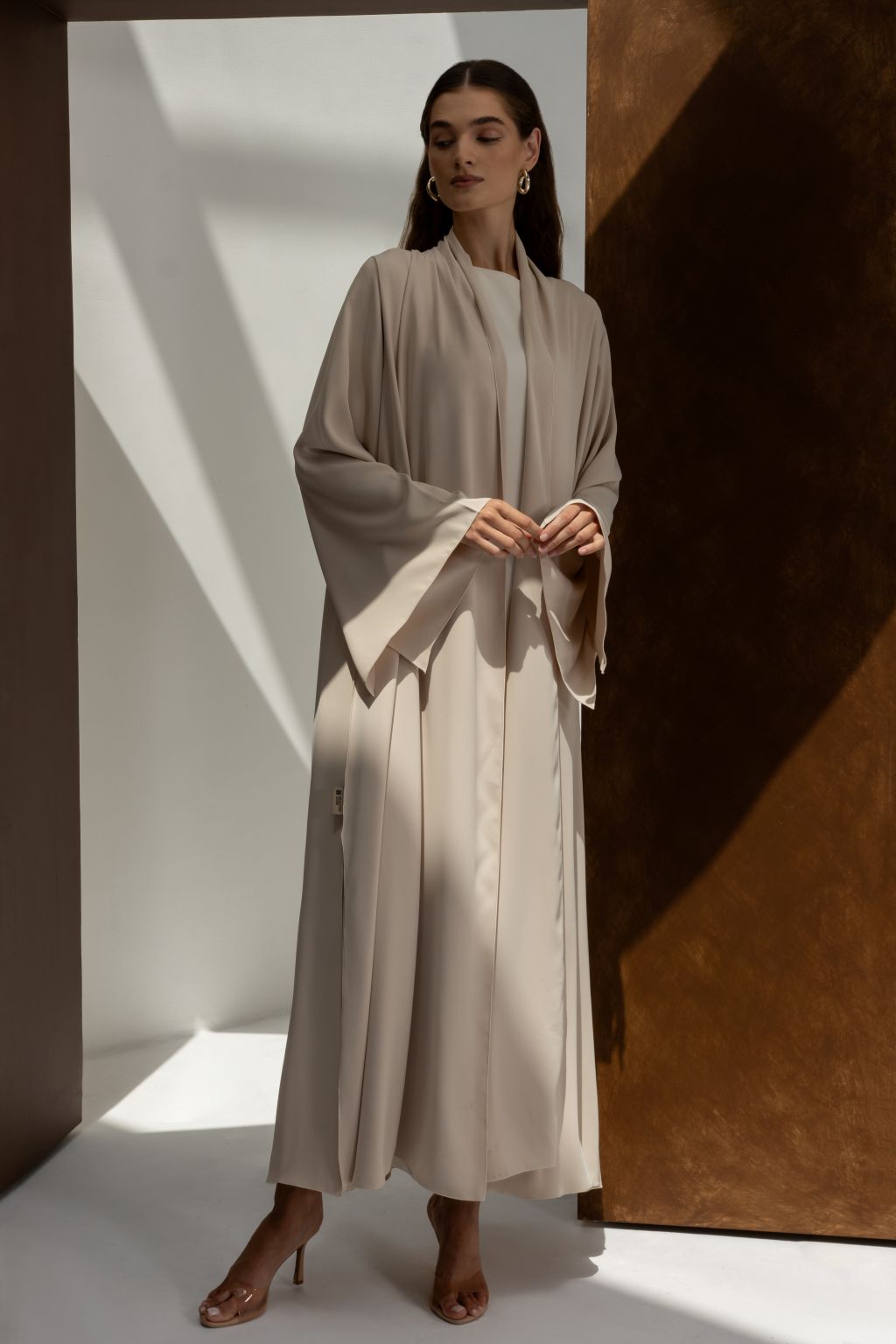 Elegant women’s Franci abaya by Selected Lines in beige with wide sleeves and flowing fabric