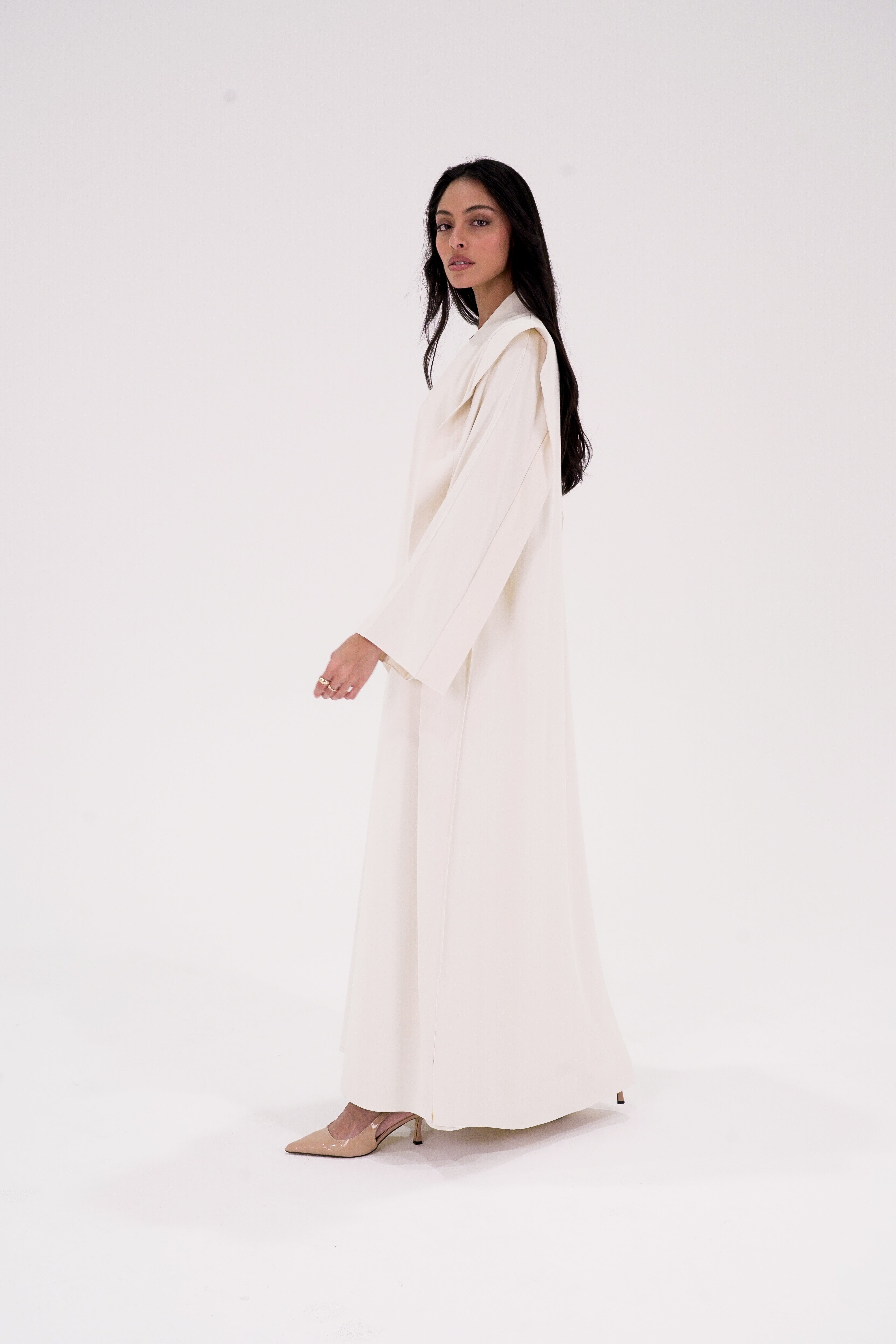 Elegant high quality shoulder abaya in cream color, featuring long sleeves and a flowing silhouette