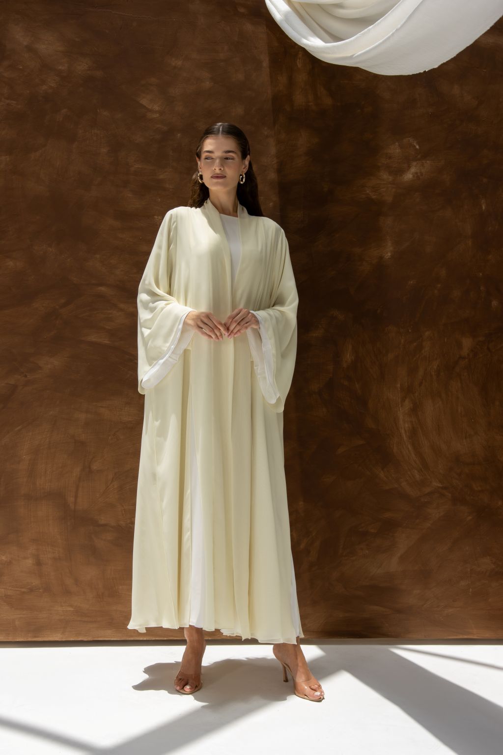 Selected Lines Layered Grace Abaya in cream with flowing sleeves and elegant drape on model