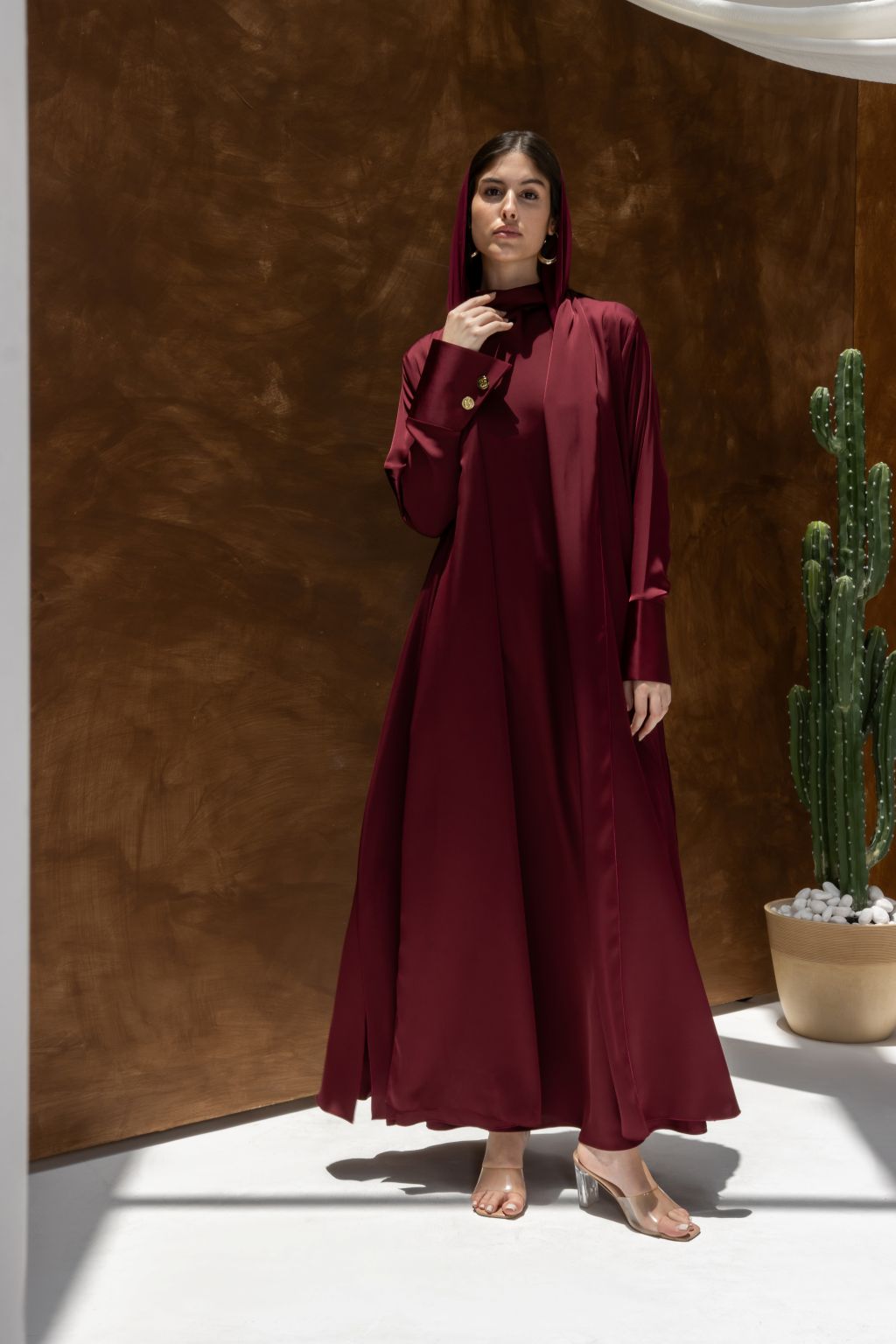 Selected Lines luxury abaya dress for women in deep burgundy with long sleeves and hood