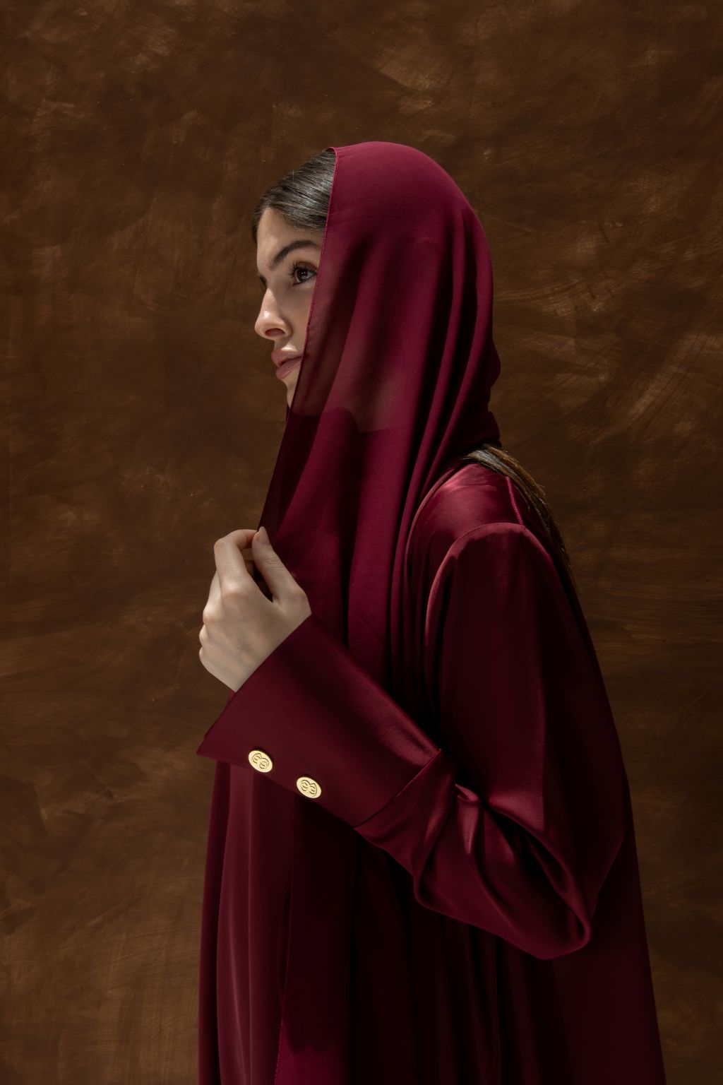 Selected Lines luxury abaya dress for women in rich burgundy with gold button details