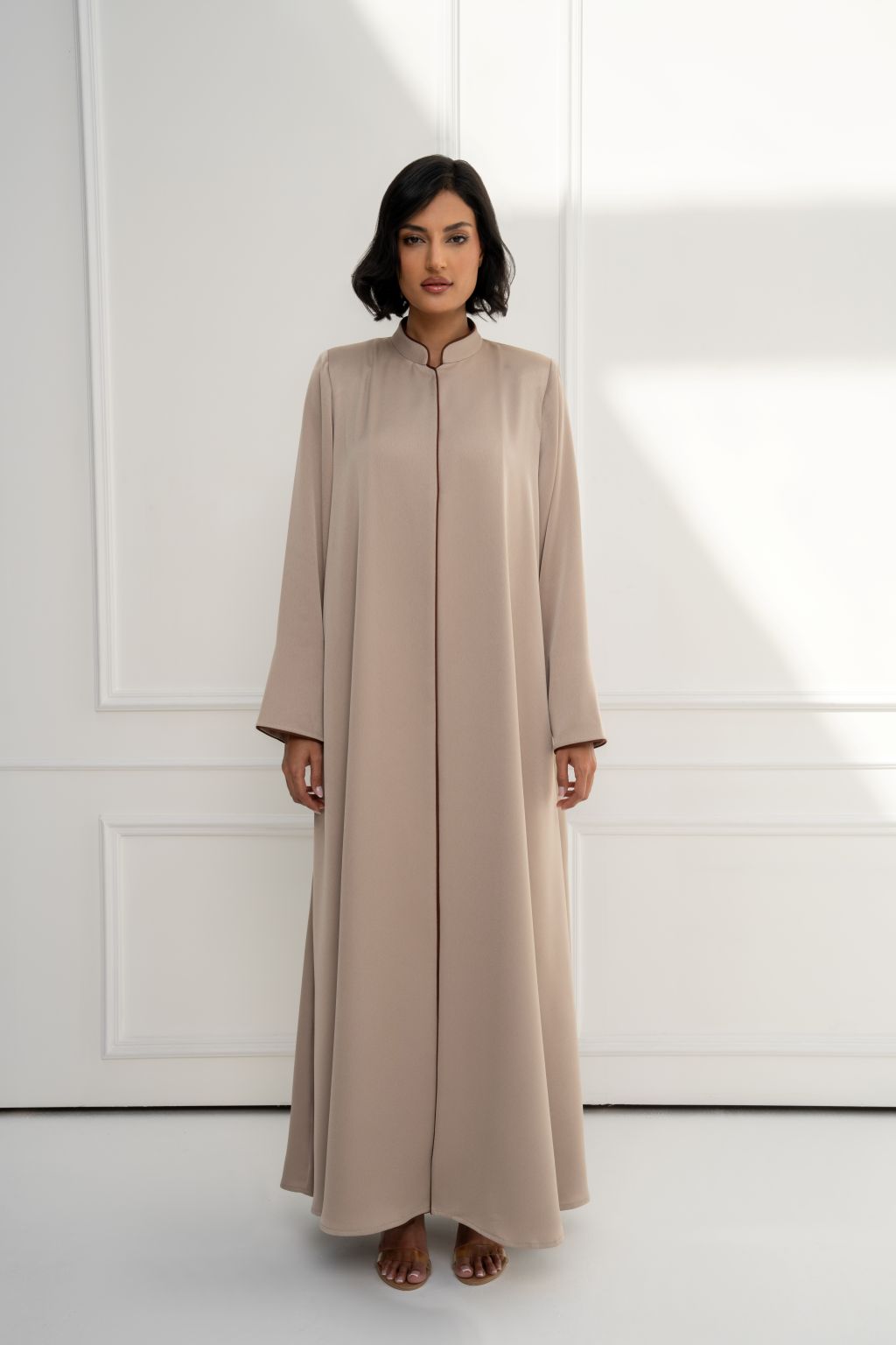 Selected Lines luxury beige long coat for women, featuring a sleek design with a comfortable fit