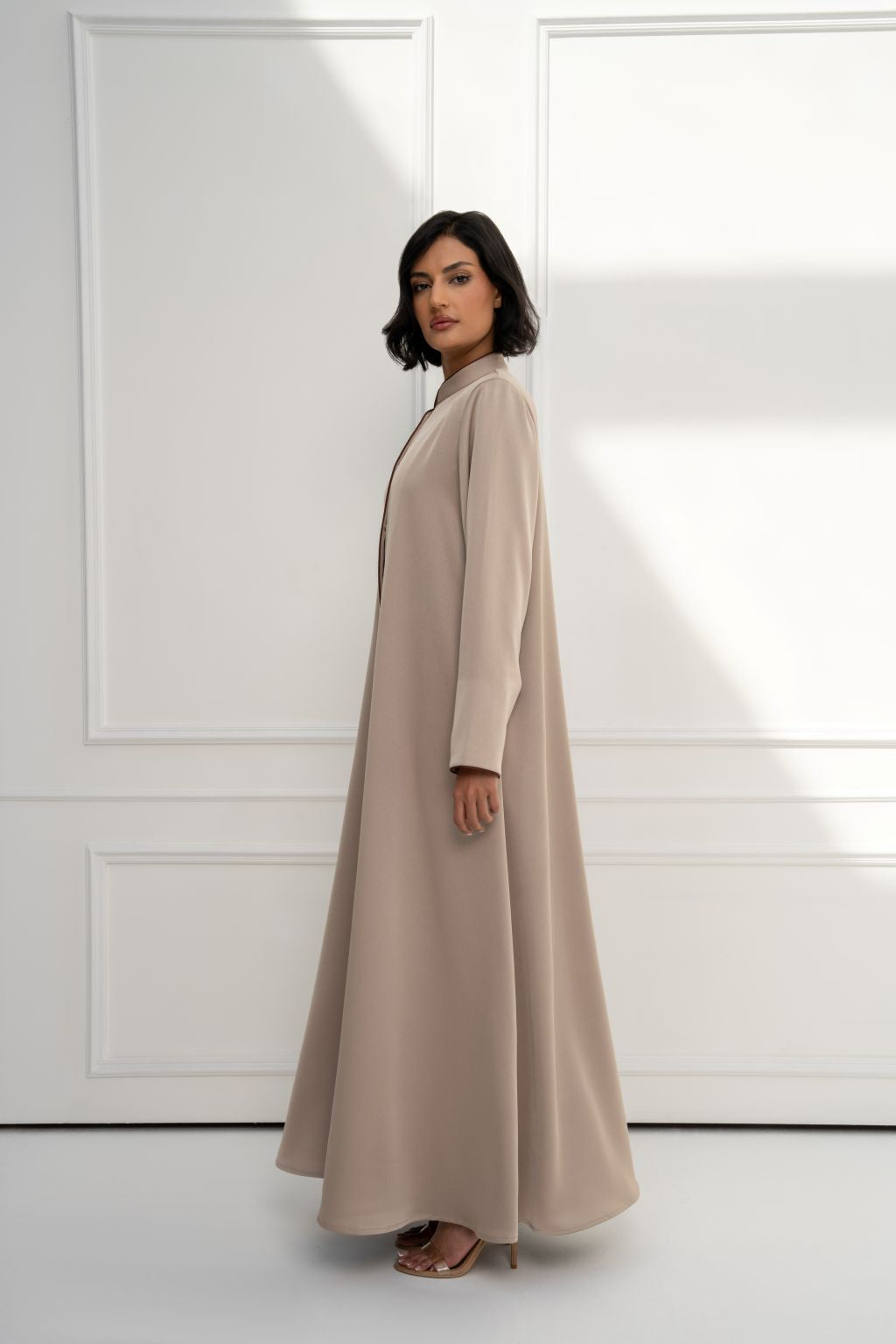 Selected Lines luxury beige long coat for women, featuring a flowing design and elegant silhouette