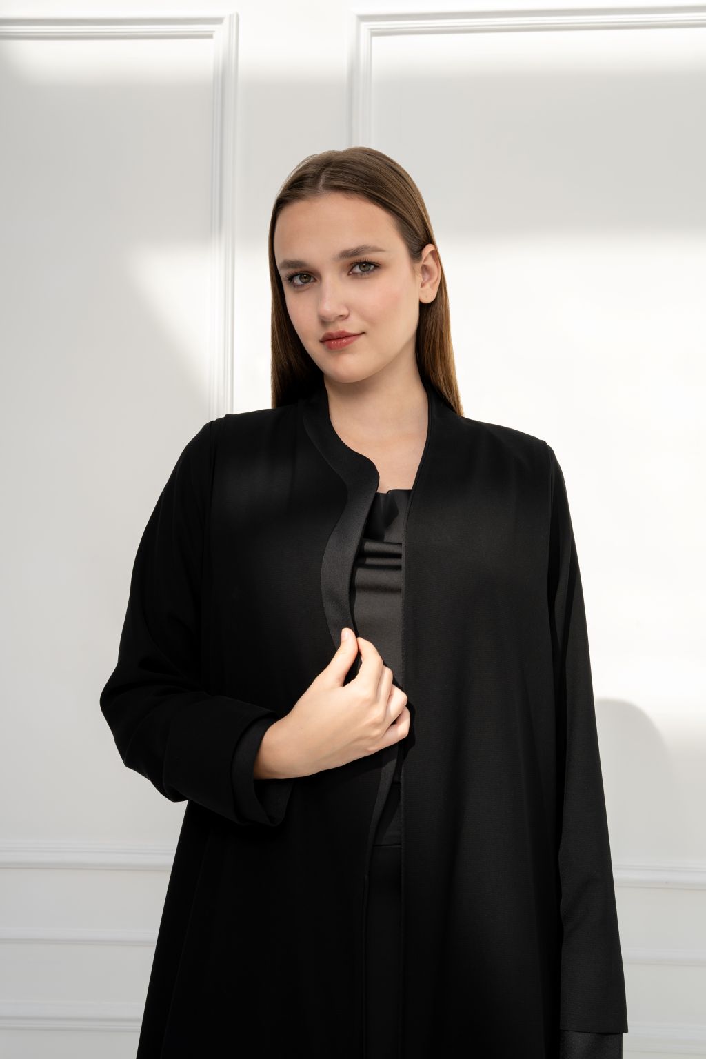 Selected Lines luxury black abaya featuring a sleek design and modern silhouette for elegant wear.