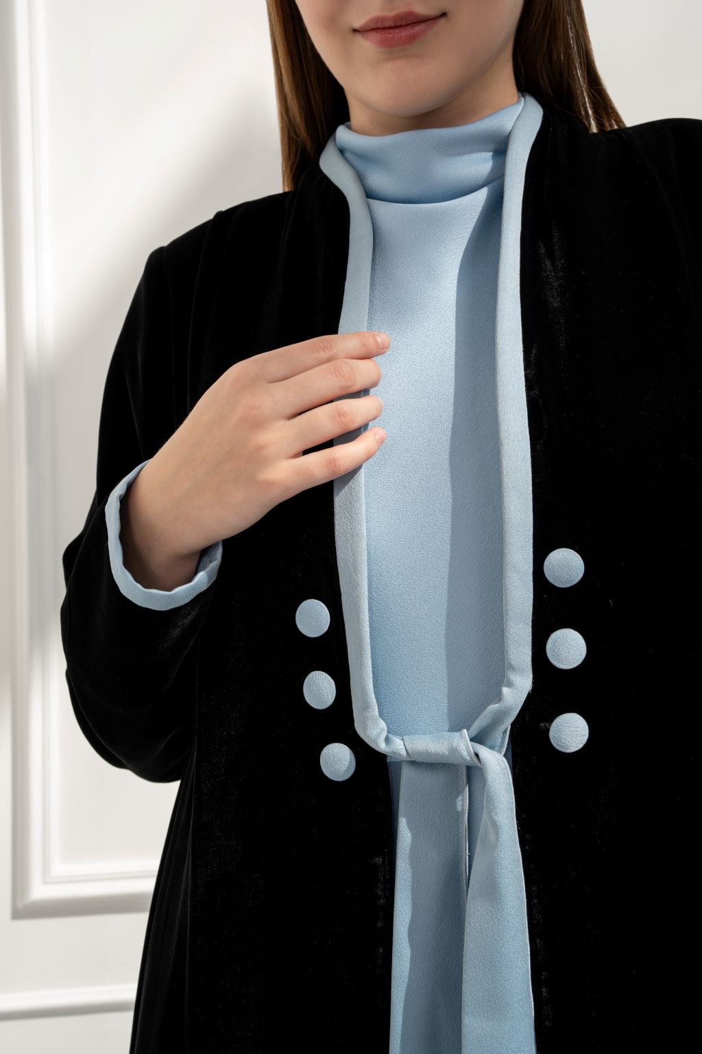 Selected Lines luxury black abaya with light blue accents and stylish button details for elegant wear