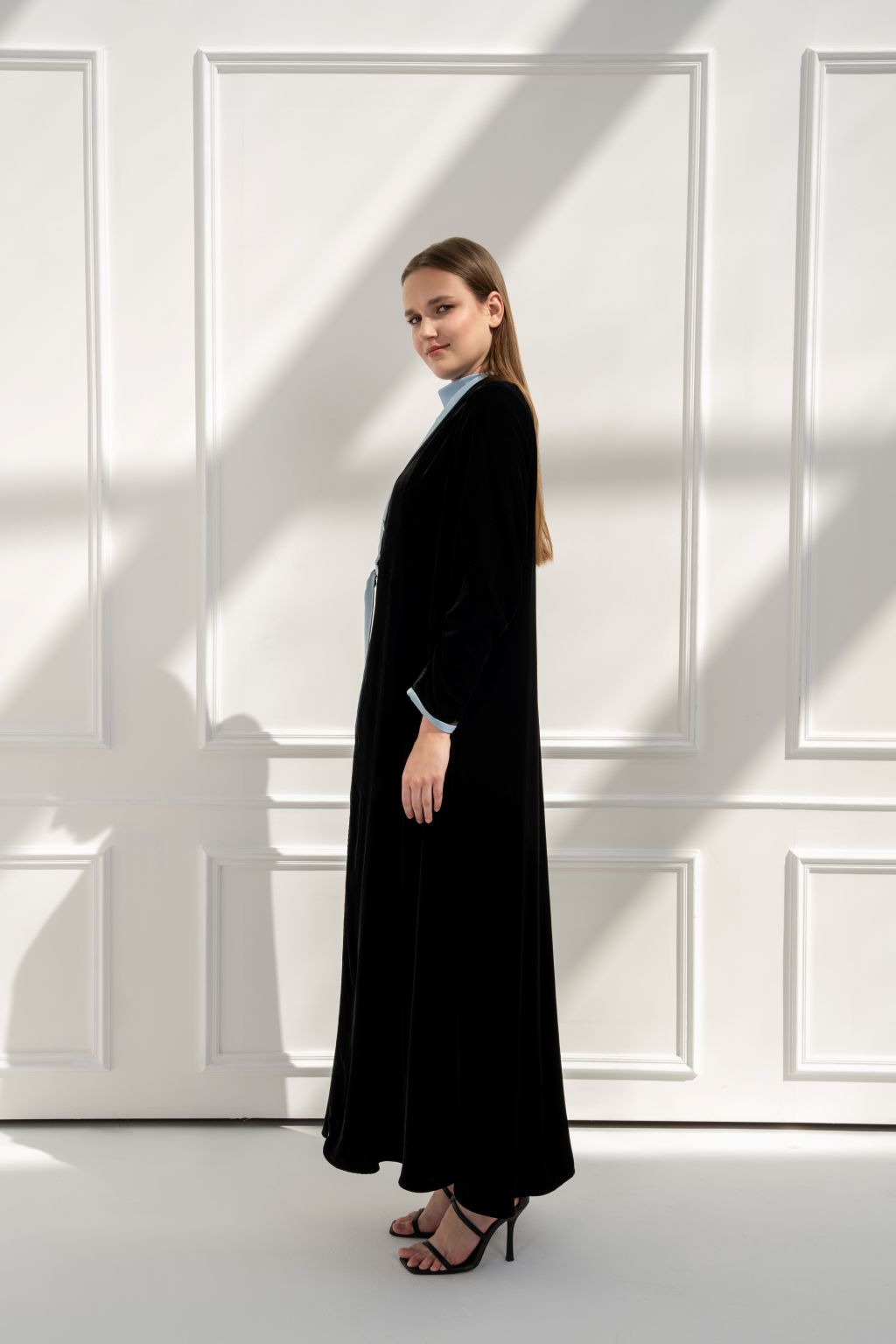 Selected Lines luxury black abaya in a sleek design, featuring long sleeves and a flowing silhouette