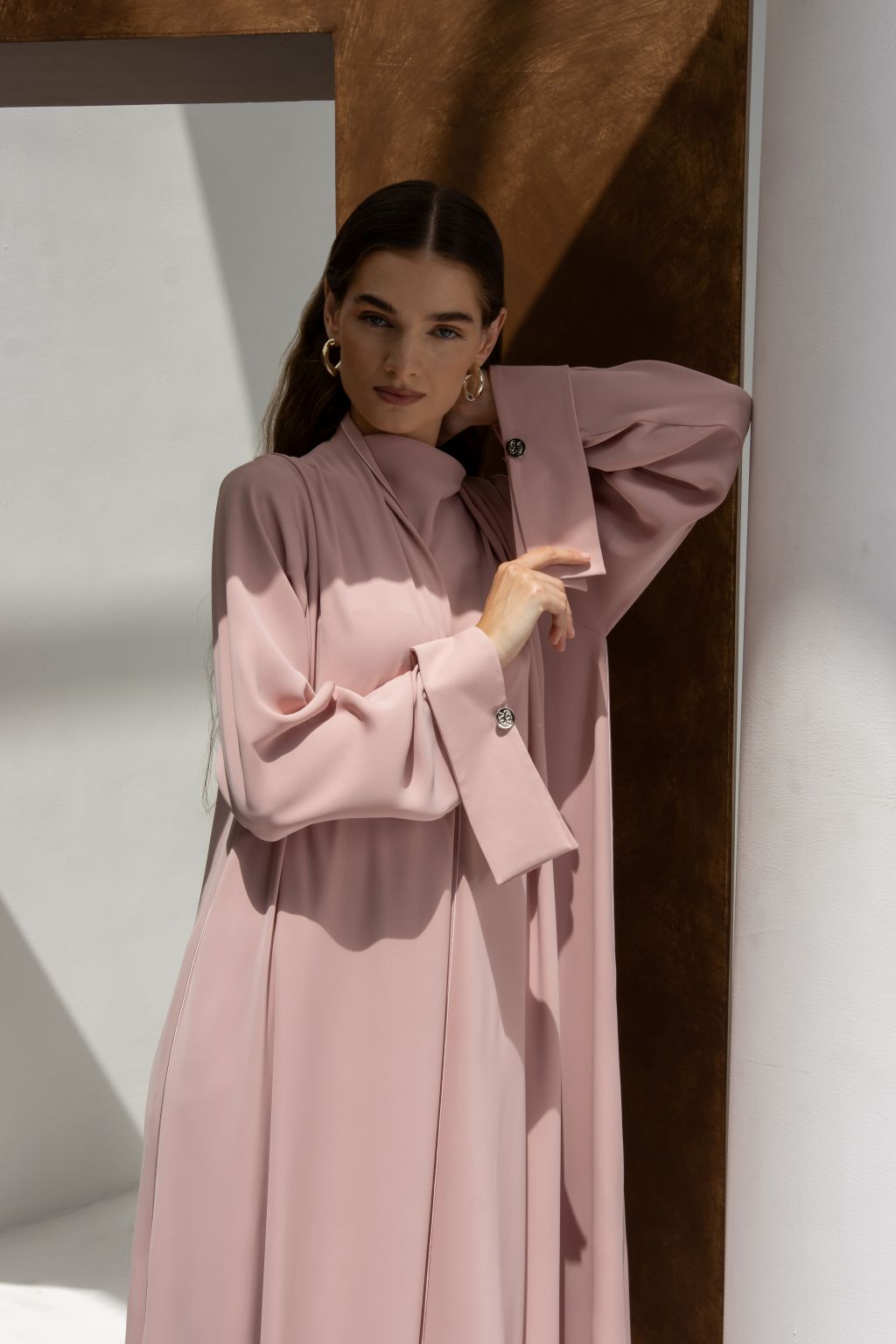 Selected Lines luxury buttoned abaya in soft pink with long sleeves and stylish button details