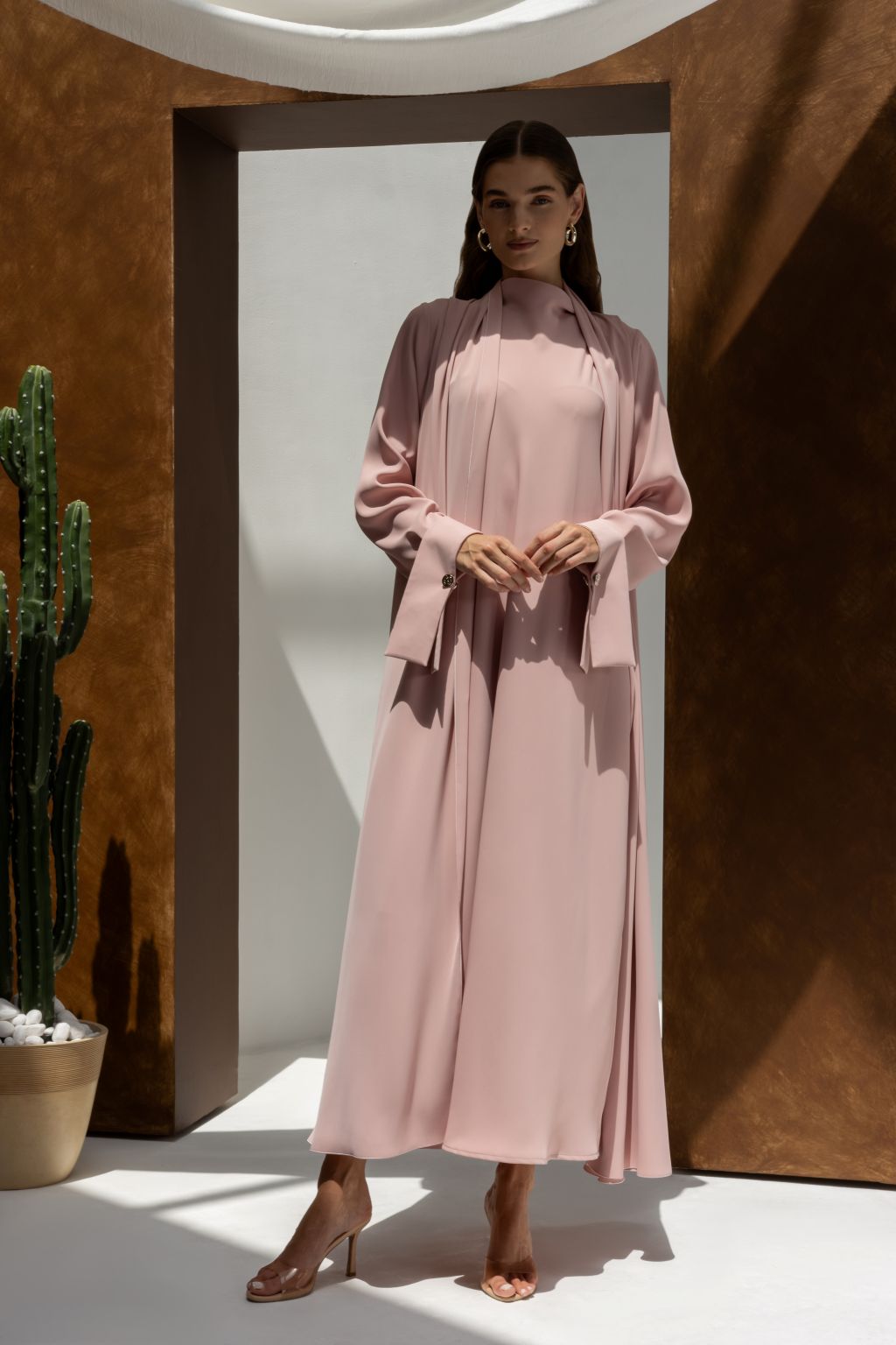 Selected Lines luxury buttoned abaya in soft pink with long sleeves and modest design