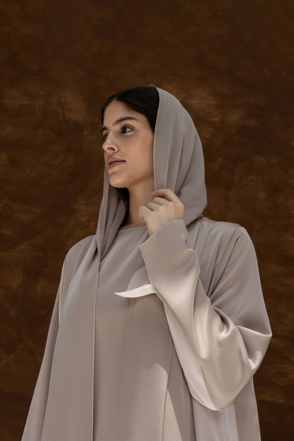 Luxury Duo Dunes abaya for women by Selected Lines in soft beige with elegant draping and hooded design