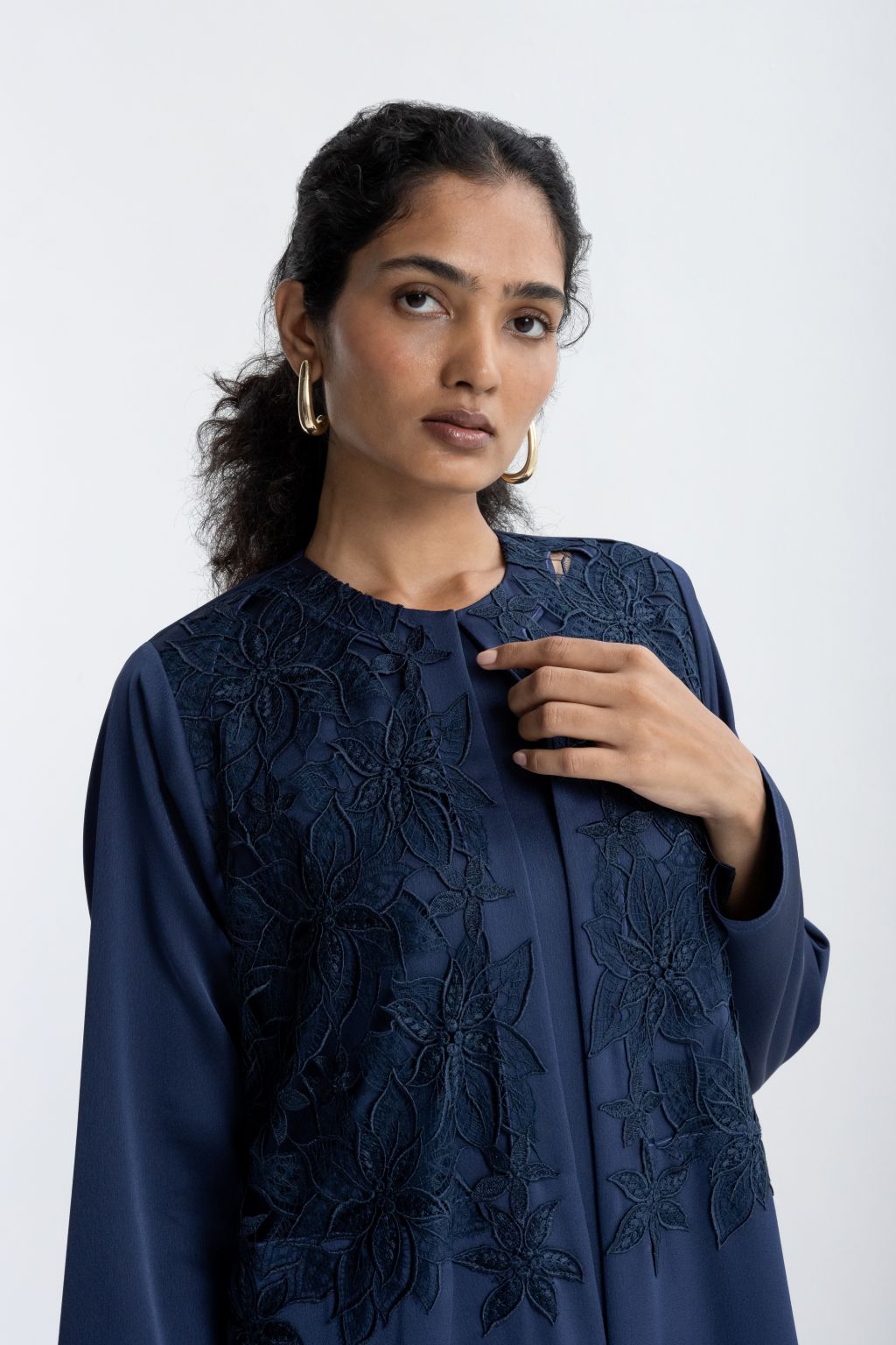 Luxury embroidered abaya in navy with floral design and elegant neckline for sophisticated style