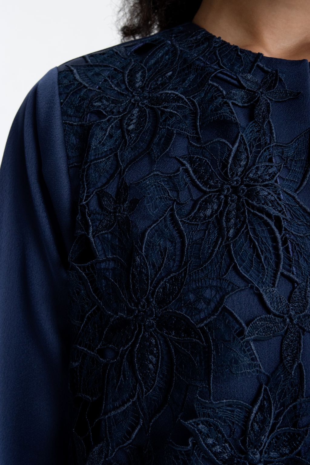 Luxury embroidered abaya in navy blue featuring intricate floral embroidery for elegant style