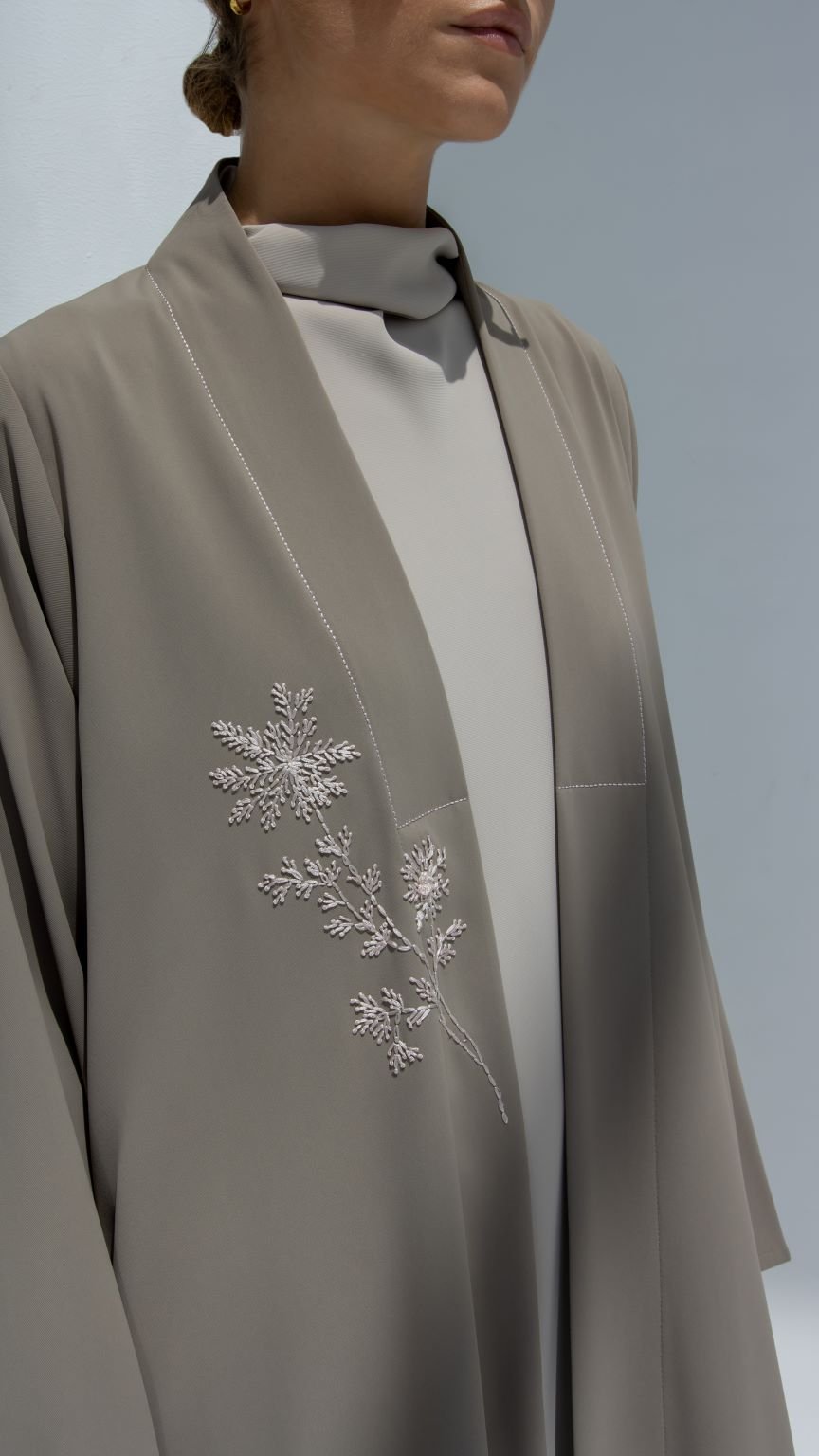 Selected Lines luxury floral threadwork abaya in beige with delicate embroidered floral design on front