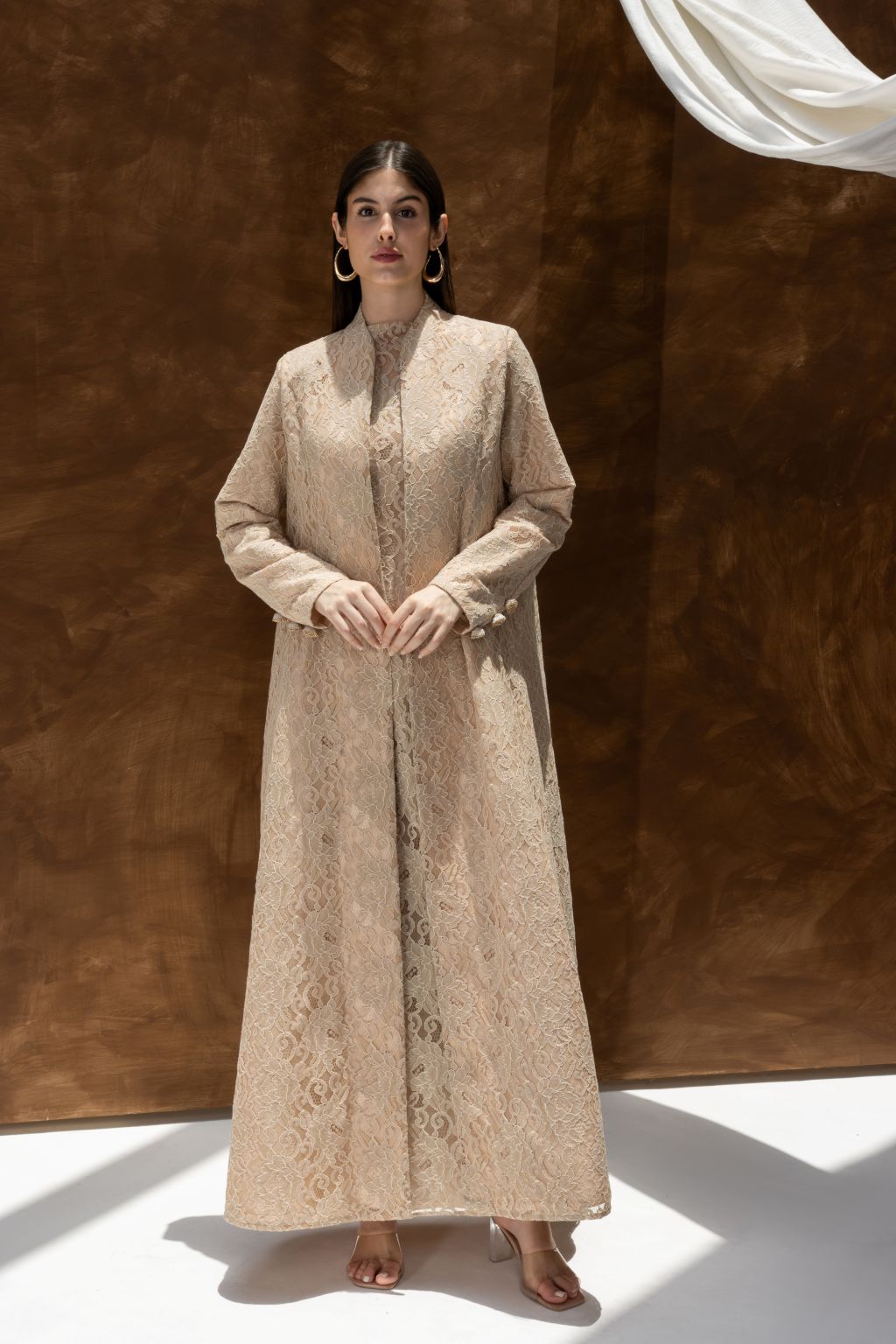 Selected Lines luxury lace Duntel Enchante abaya in beige worn by model with long sleeves and full length design
