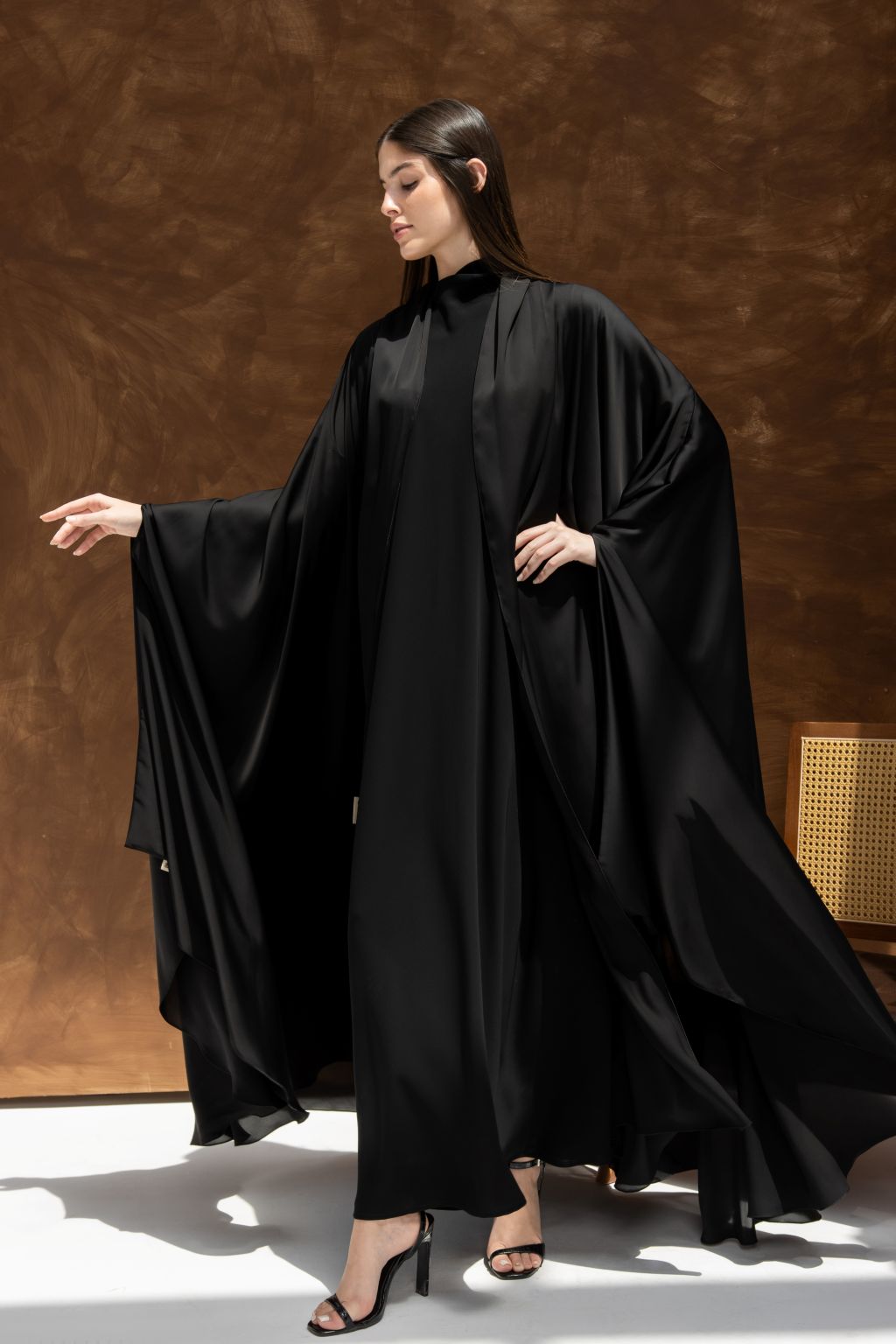 Elegant black luxury silk abaya with flowing sleeves for a sophisticated look