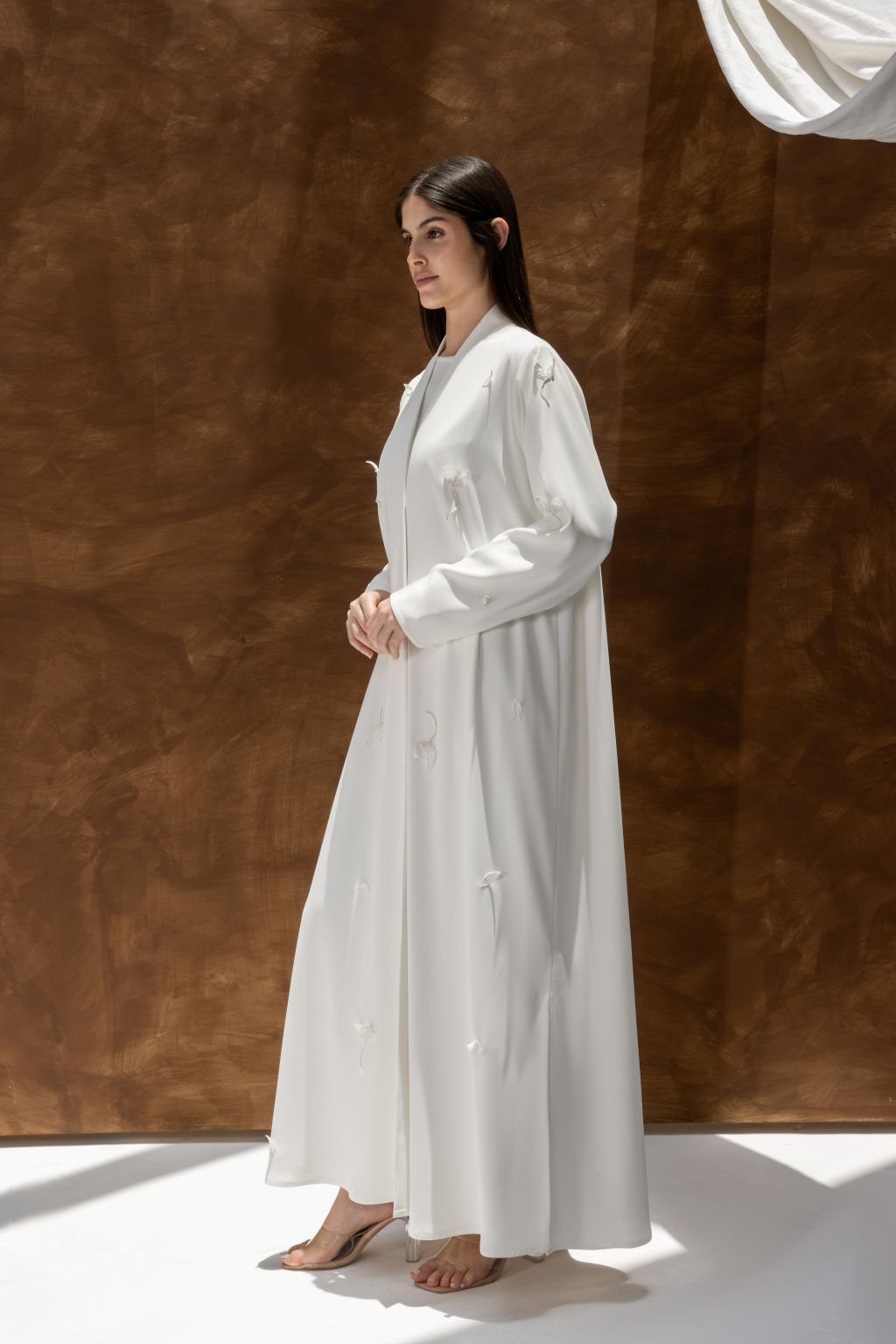 Selected Lines luxury white abaya dress with long sleeves and elegant flowy design