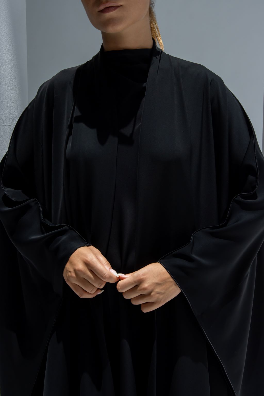 Elegant Mermaid Stitch Abaya in black with flowing sleeves and modern design for stylish occasions